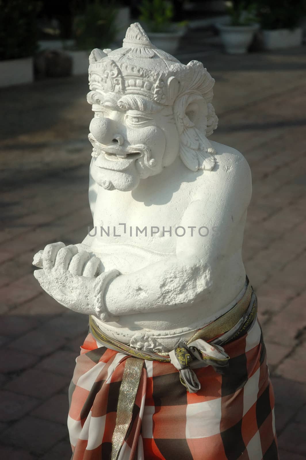 balinese statue that found in the middle of garden
