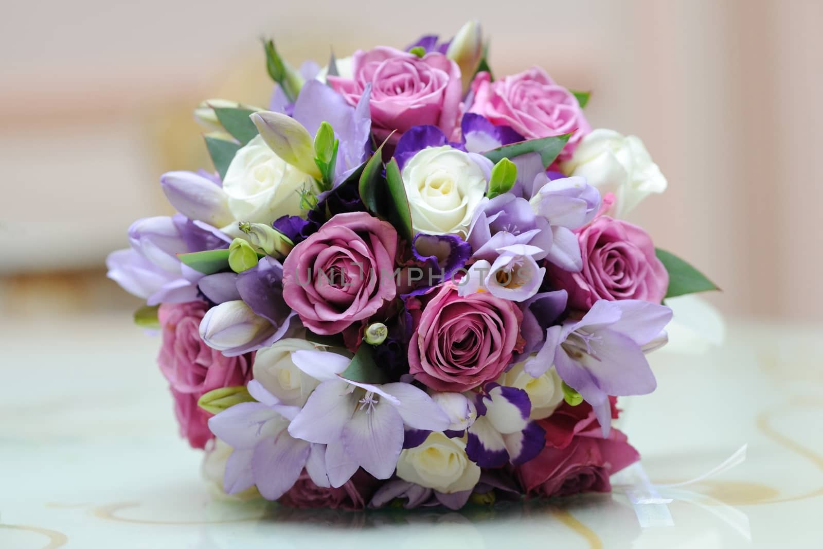 Brides colourful bouquet on a table.