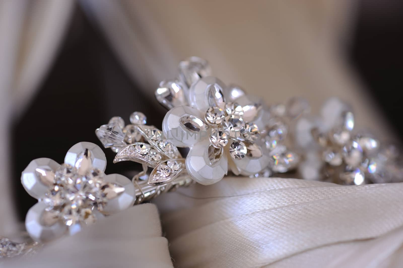 Close up of brides tiara resting on her shoes.