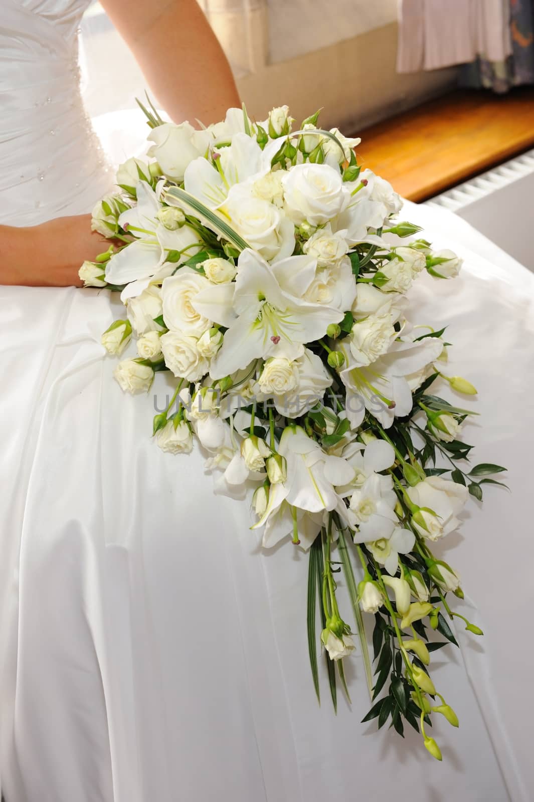 Brides white lilies and roses.