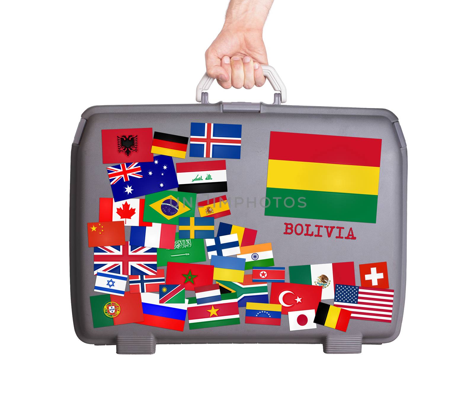 Used plastic suitcase with lots of small stickers, large sticker of Bolivia