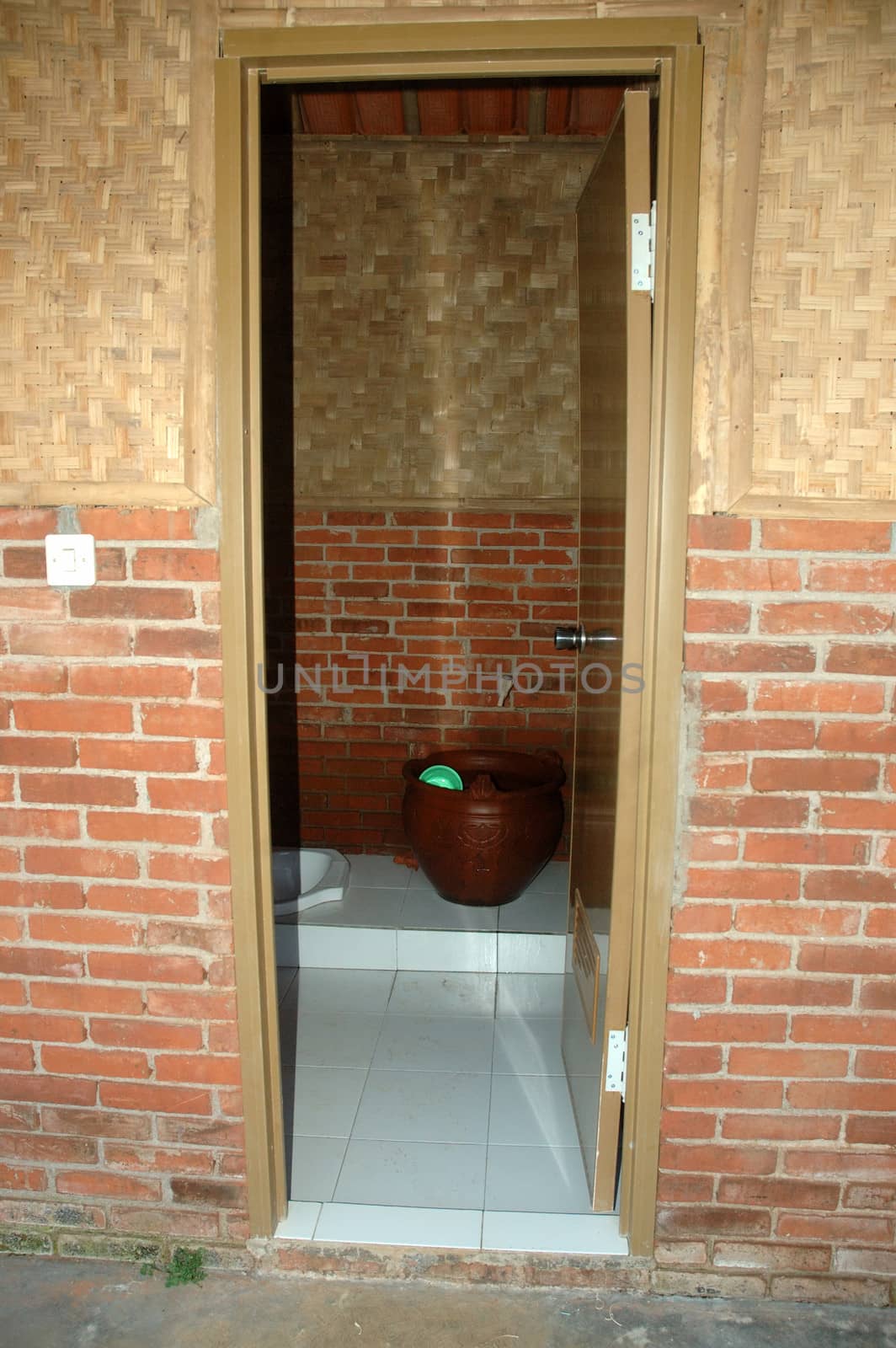 outdoor toilet that found in the middle of cottage area