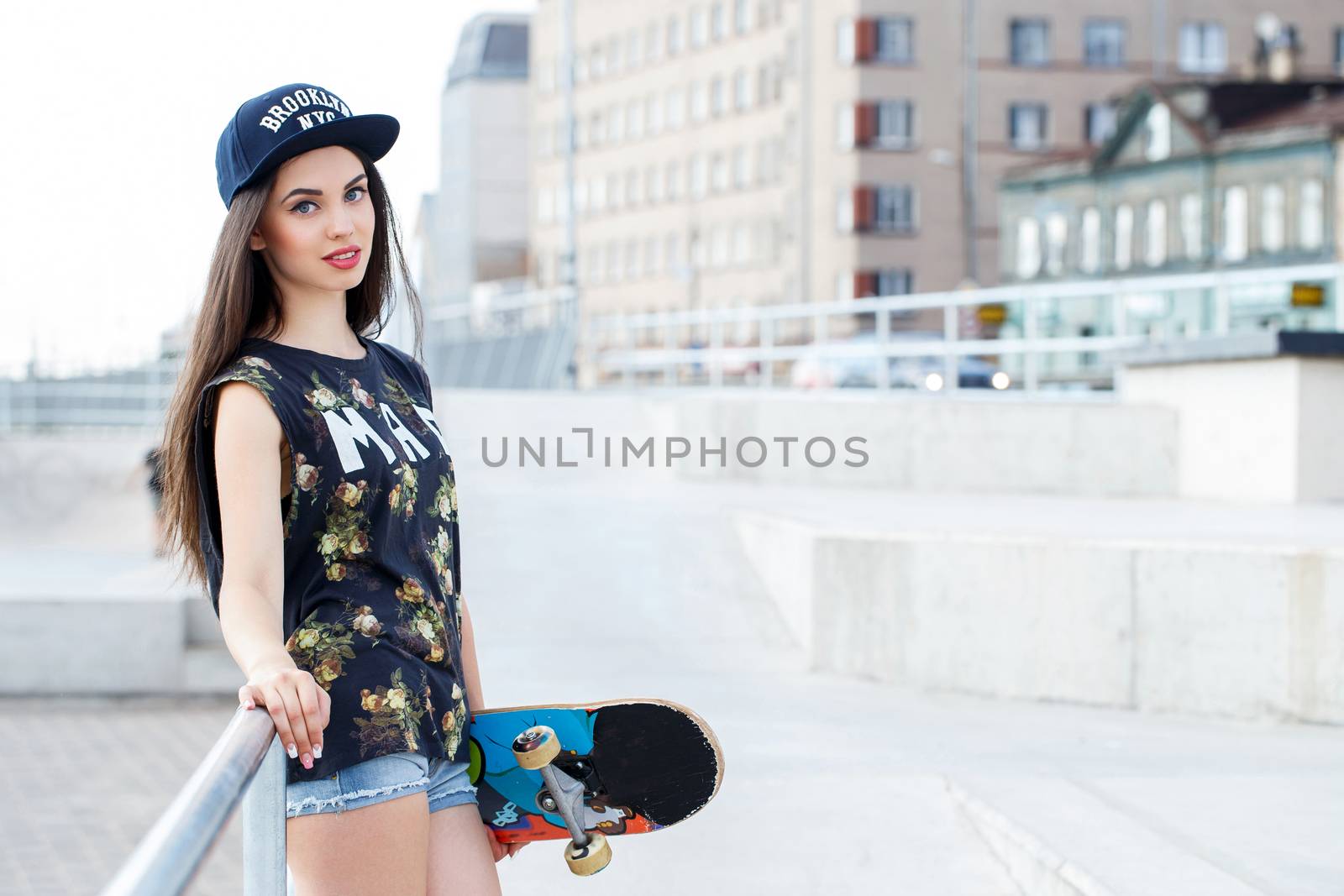 Street, outdoor. Attractive teen in a cap