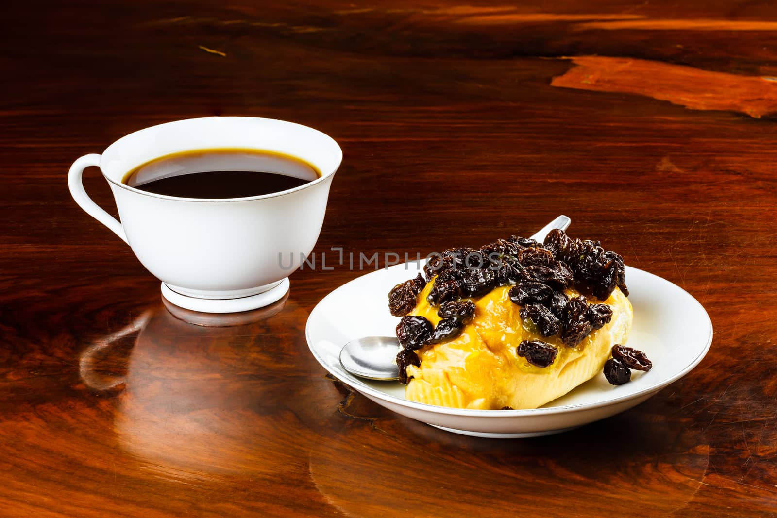 Raisin bread and a cup of coffee