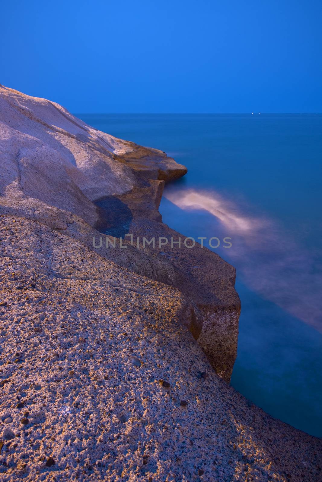 Night background landscape view of the rocky beach