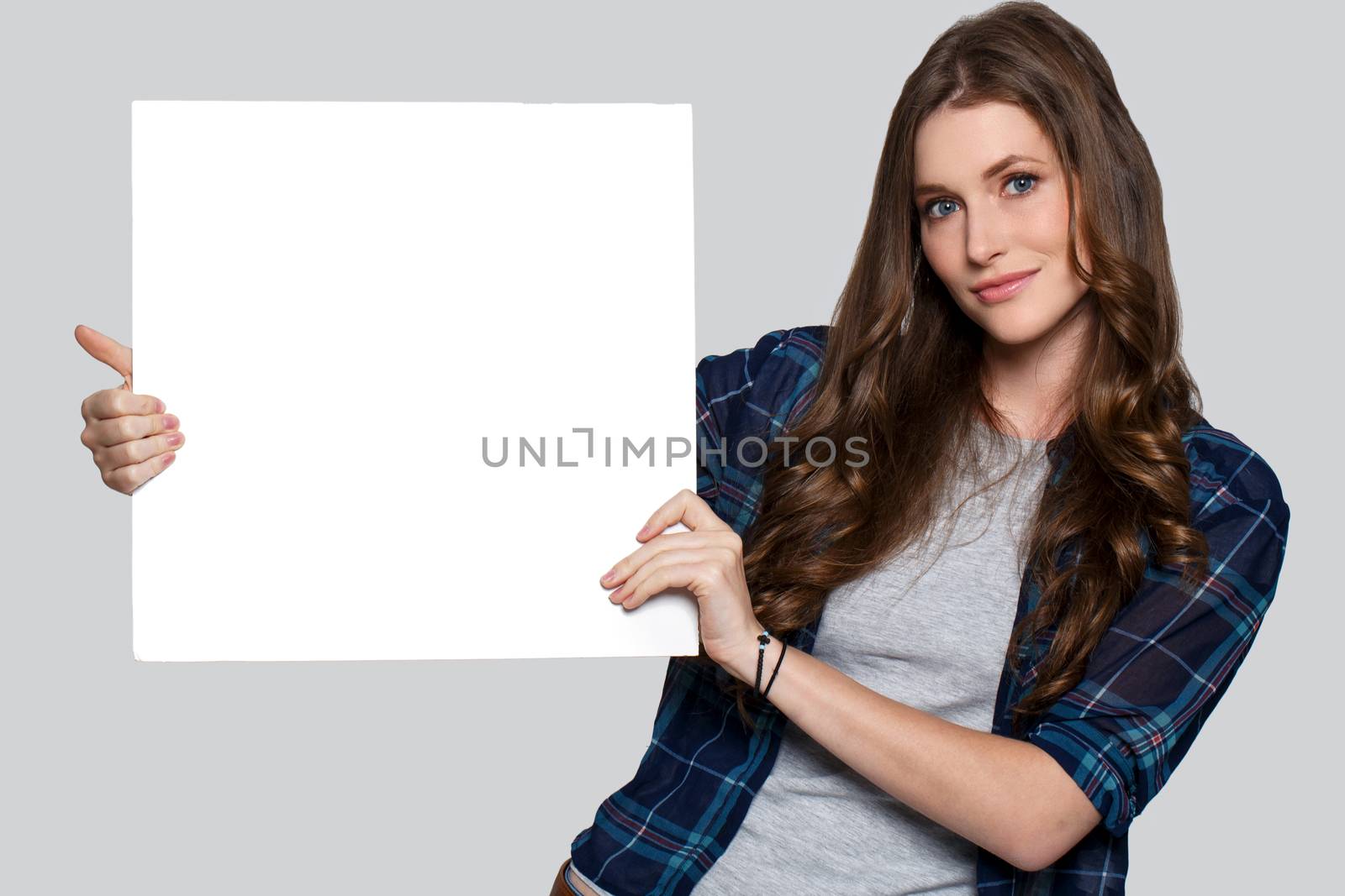 Beautiful woman with white billboard