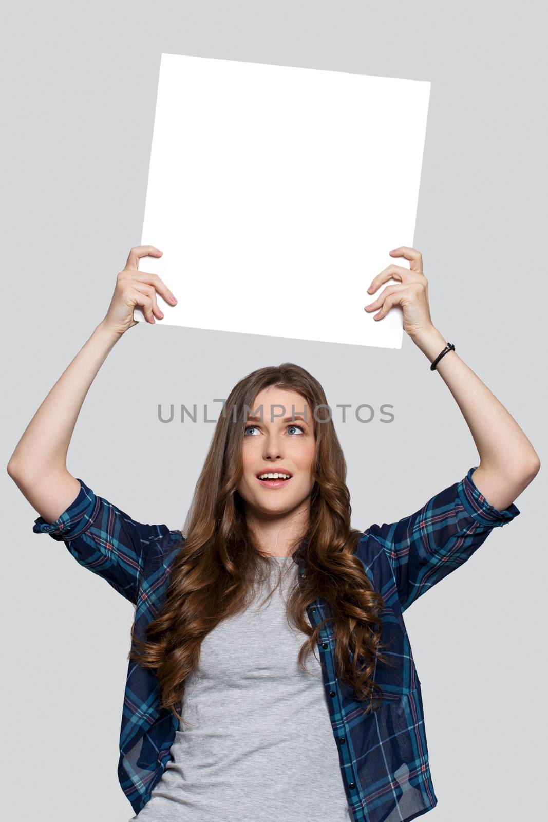 Beautiful woman with white billboard