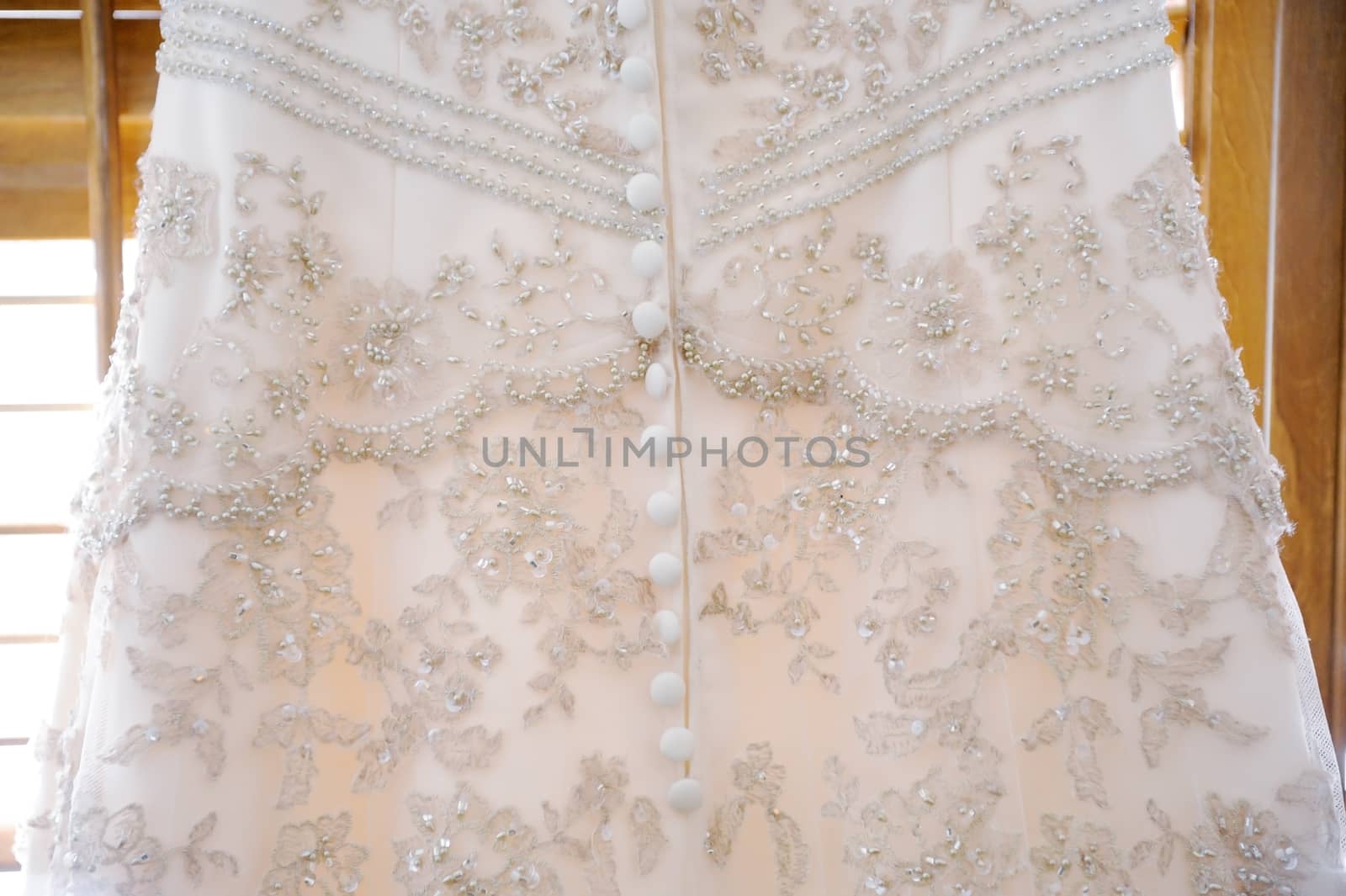 Brides dress close-up showing detail on wedding day