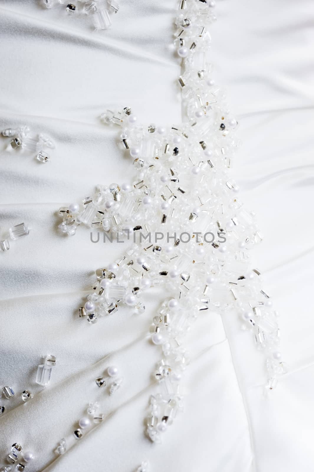 Closeup of brides dress detail on wedding day