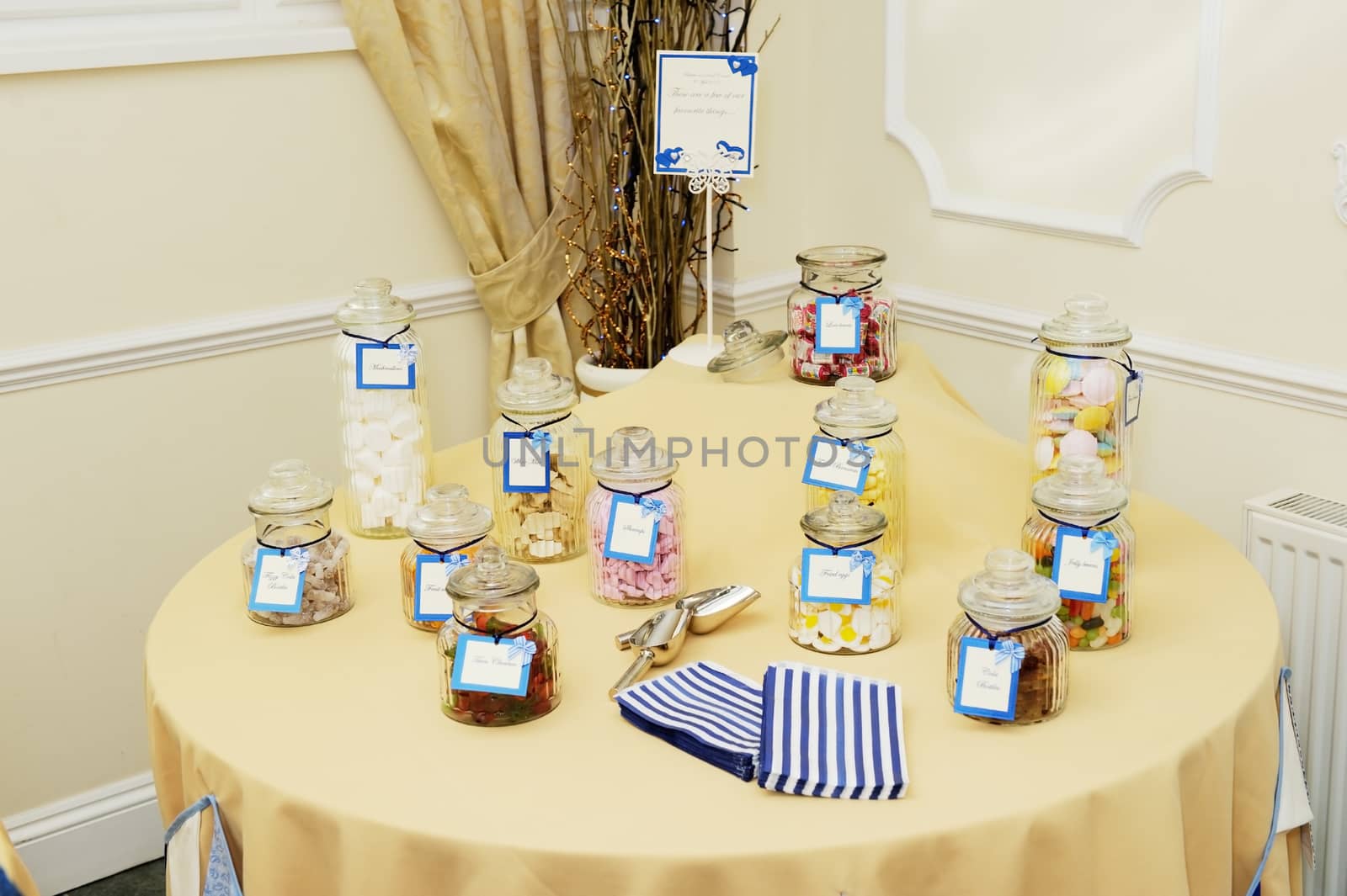 Table at wedding reception with sweets and candy