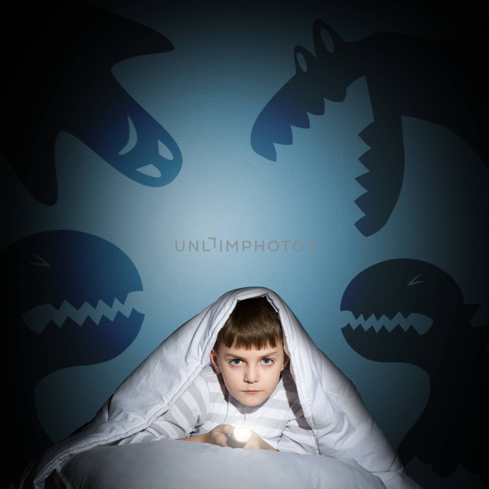 boy under the covers with a flashlight by adam121