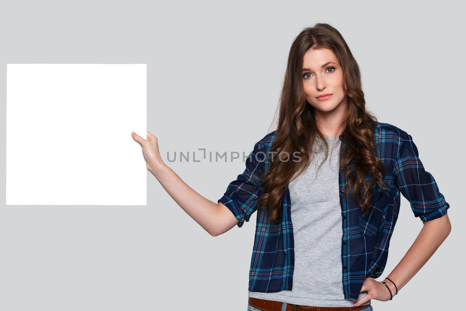 Beautiful woman with white billboard