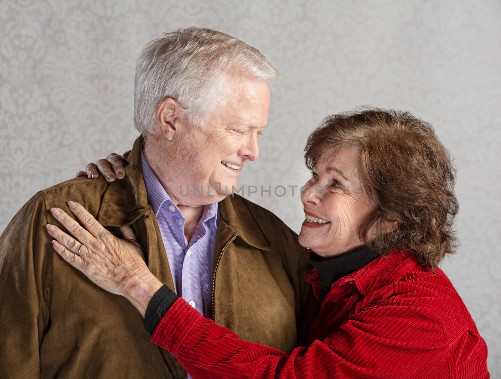 Senior husband and wife looking in each others eyes