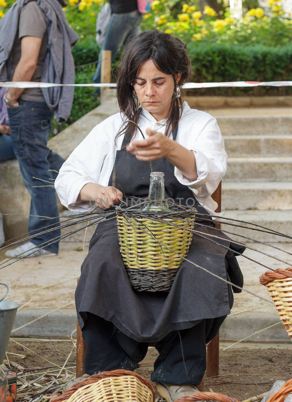 TARRASA, SPAIN - MAY 08, 2011: Unidentified artist  showing the craft of basket-making in the modernist fair which is held every year in the city.