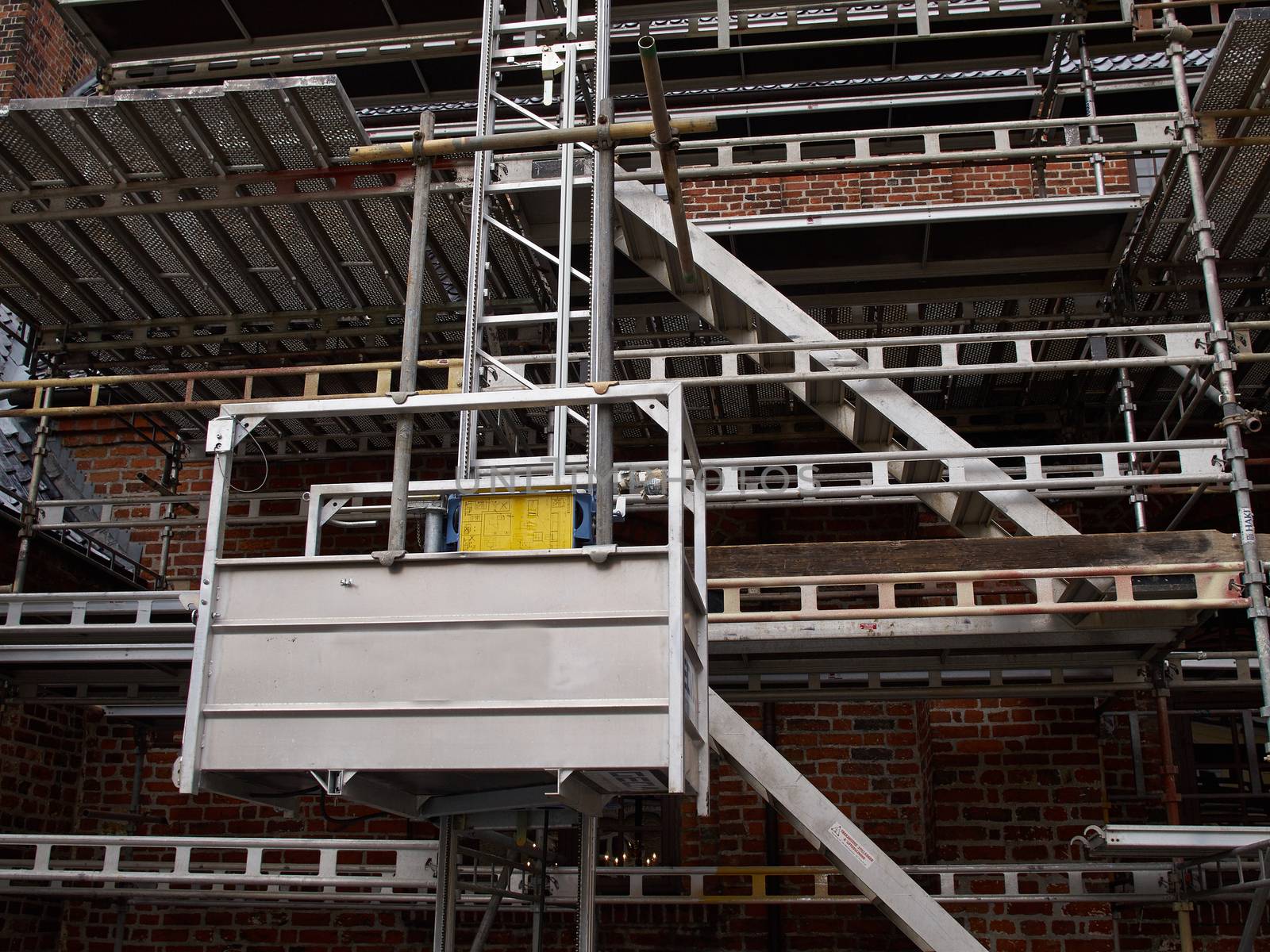 Modern sophisticated scaffolds on a house building under extensive renovations
