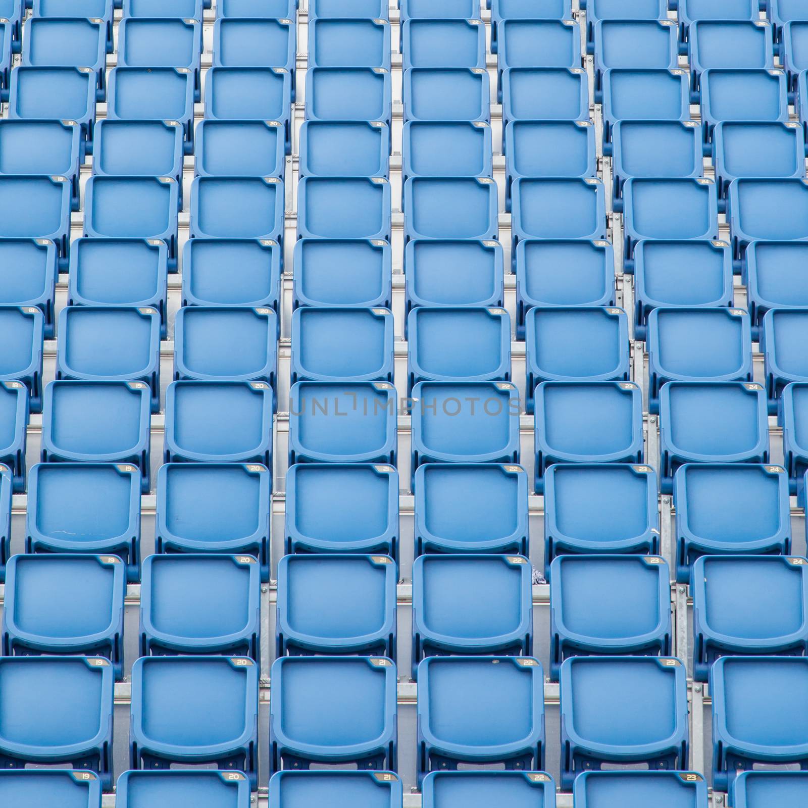 Blue seat in sport stadium by michaklootwijk