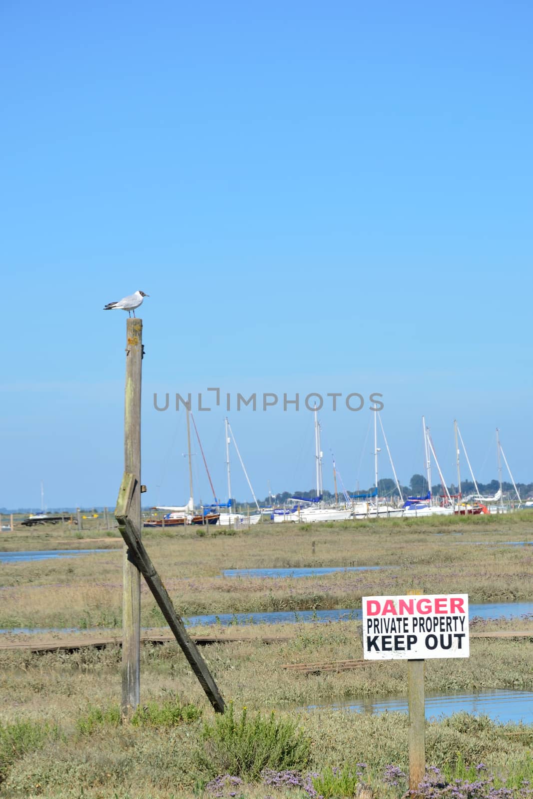 Keep out sign by coast