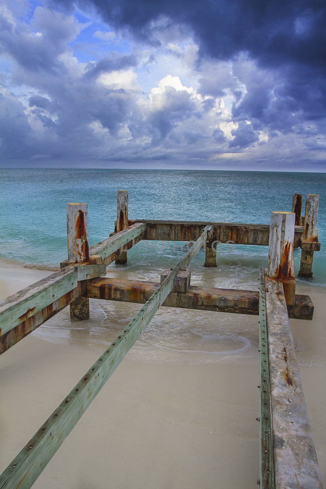 Wooden pier heading out to a beach of the atlantic ocean