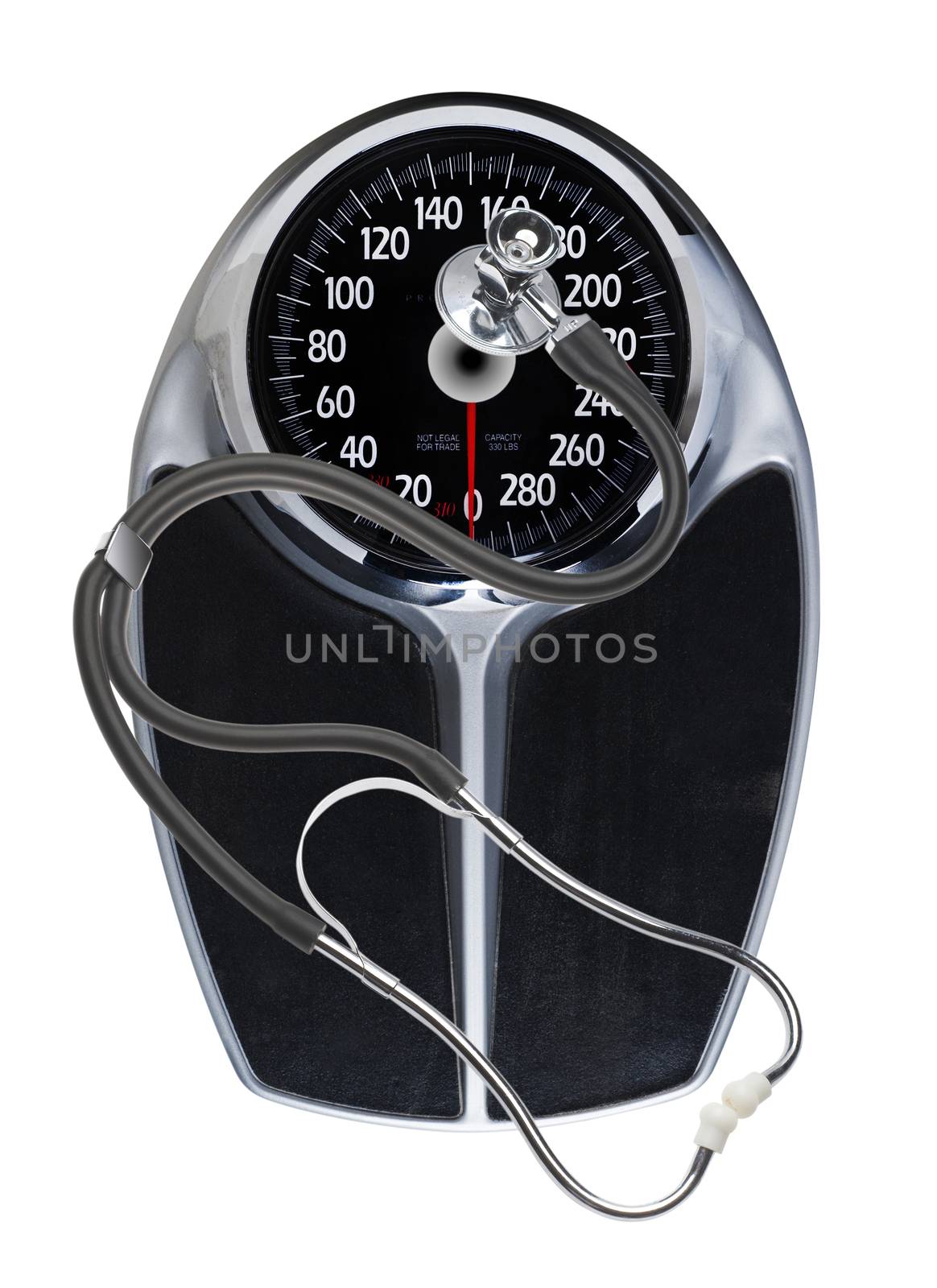 Weight problems photographically shown by a scale and stethoscope, isolated