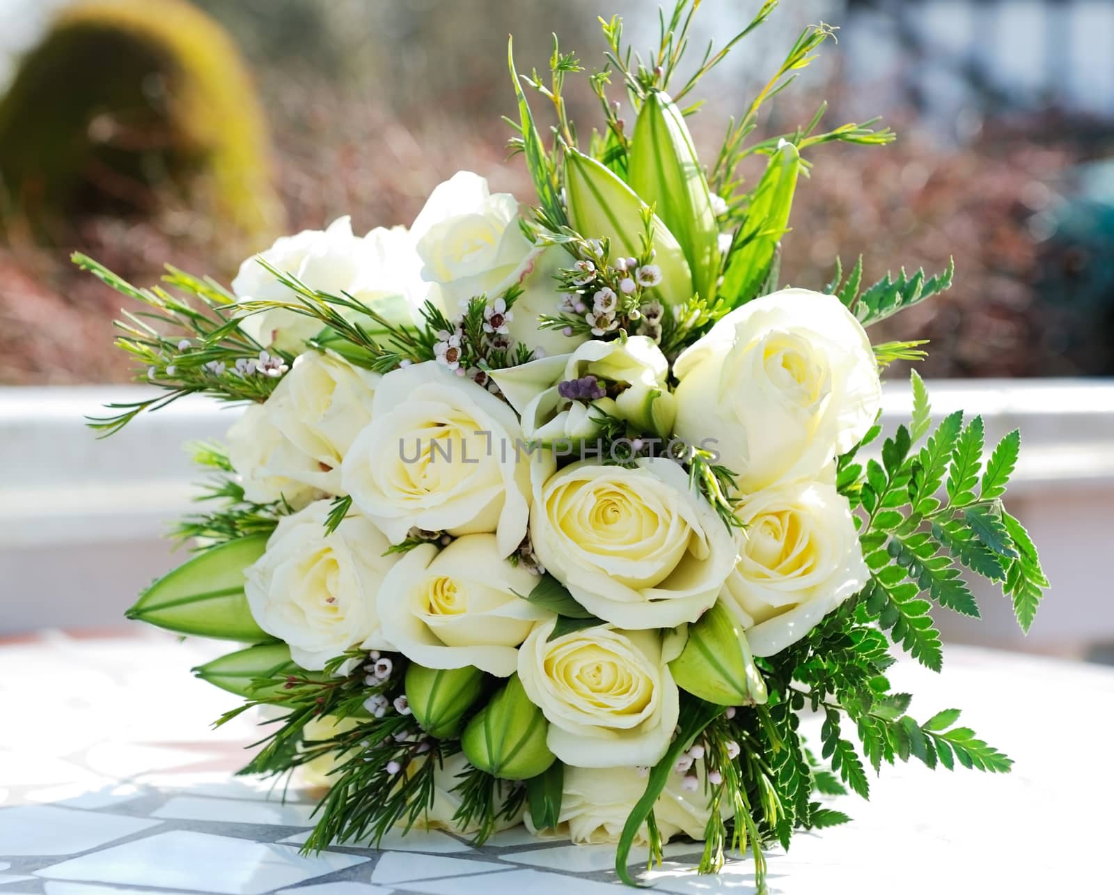 Closeup of brides bunch of white roses on wedding day