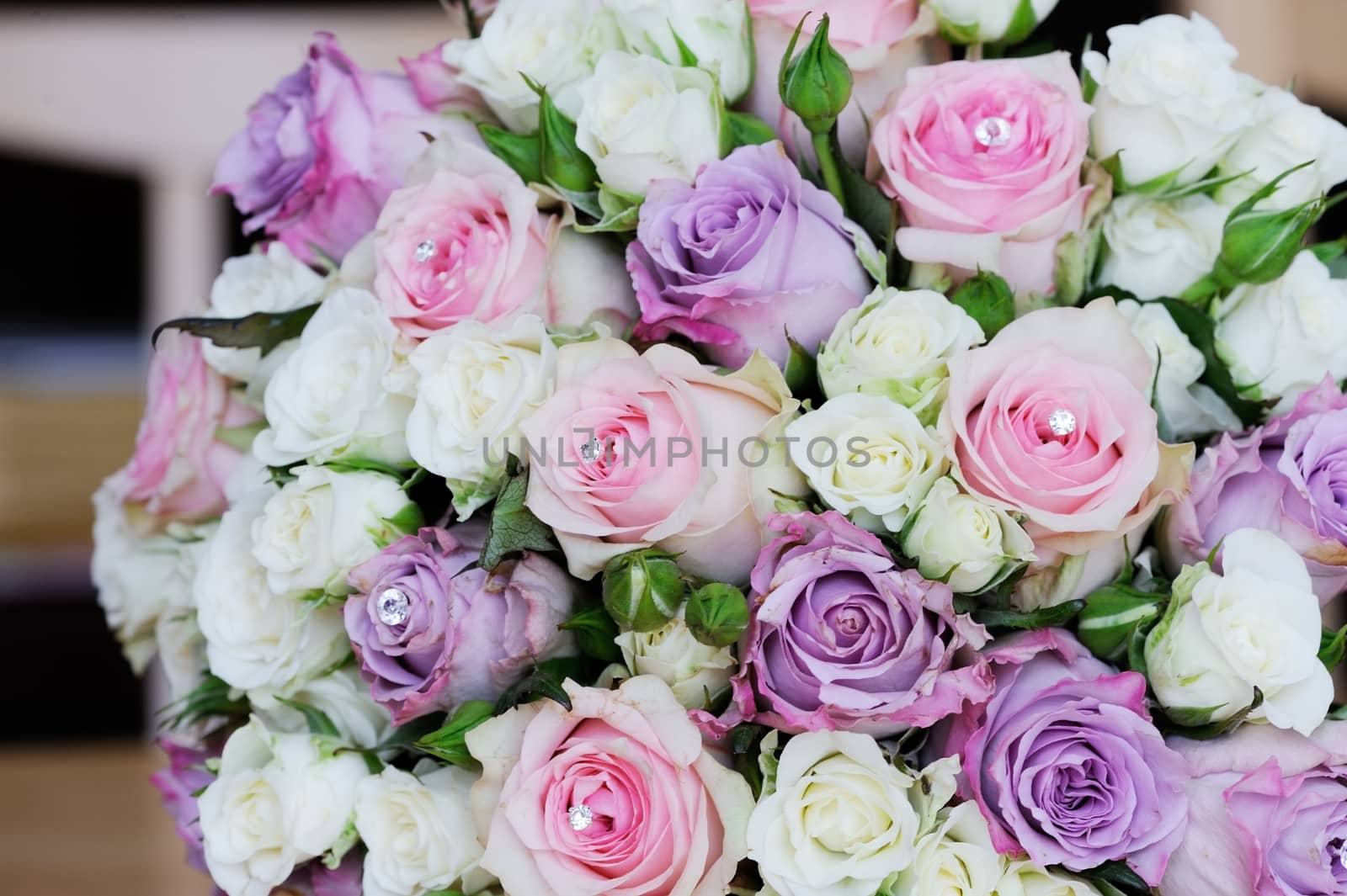 Brides flowers on wedding day with pink and purple roses