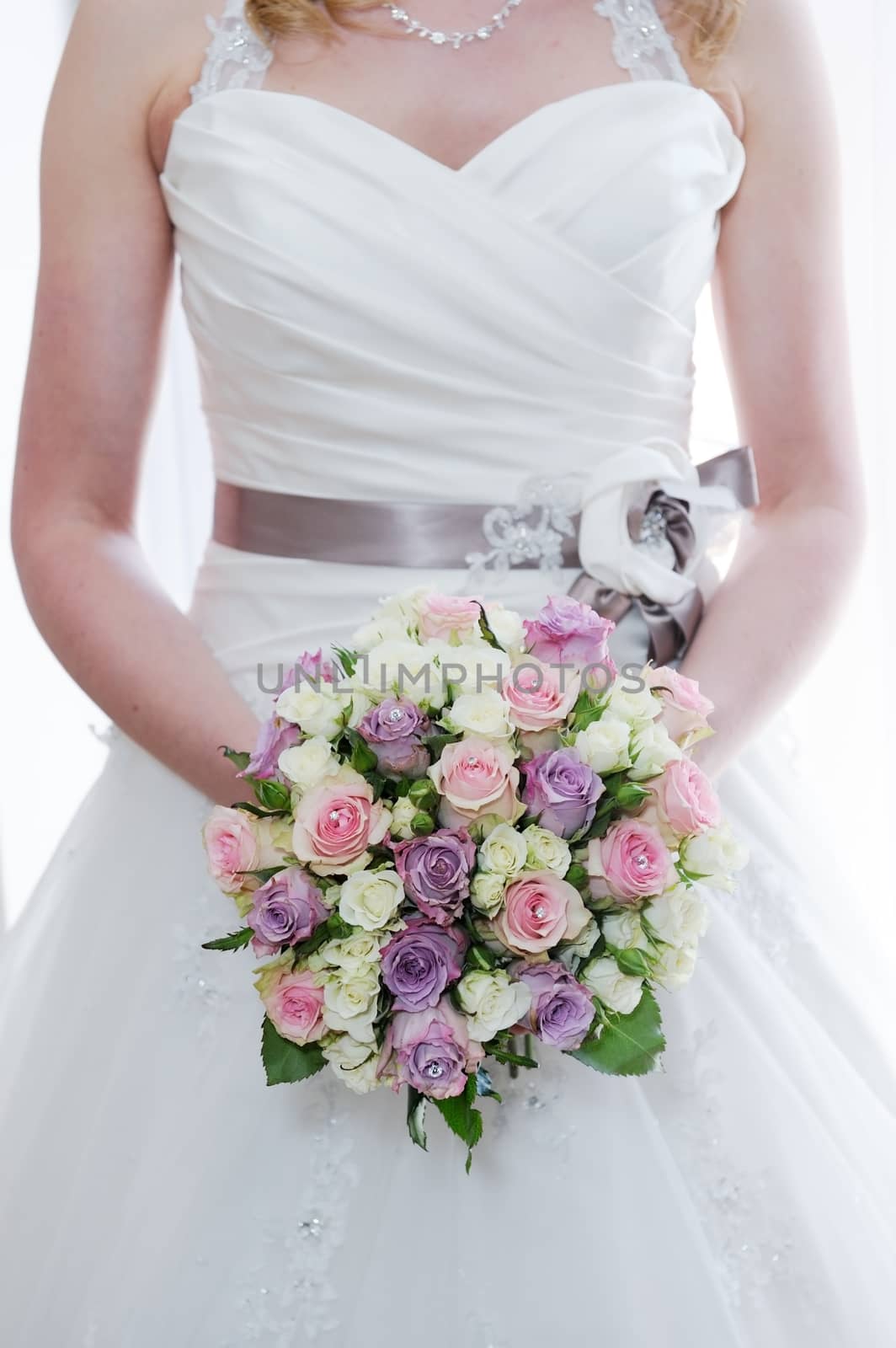 Brides bouquet and dress detail by kmwphotography