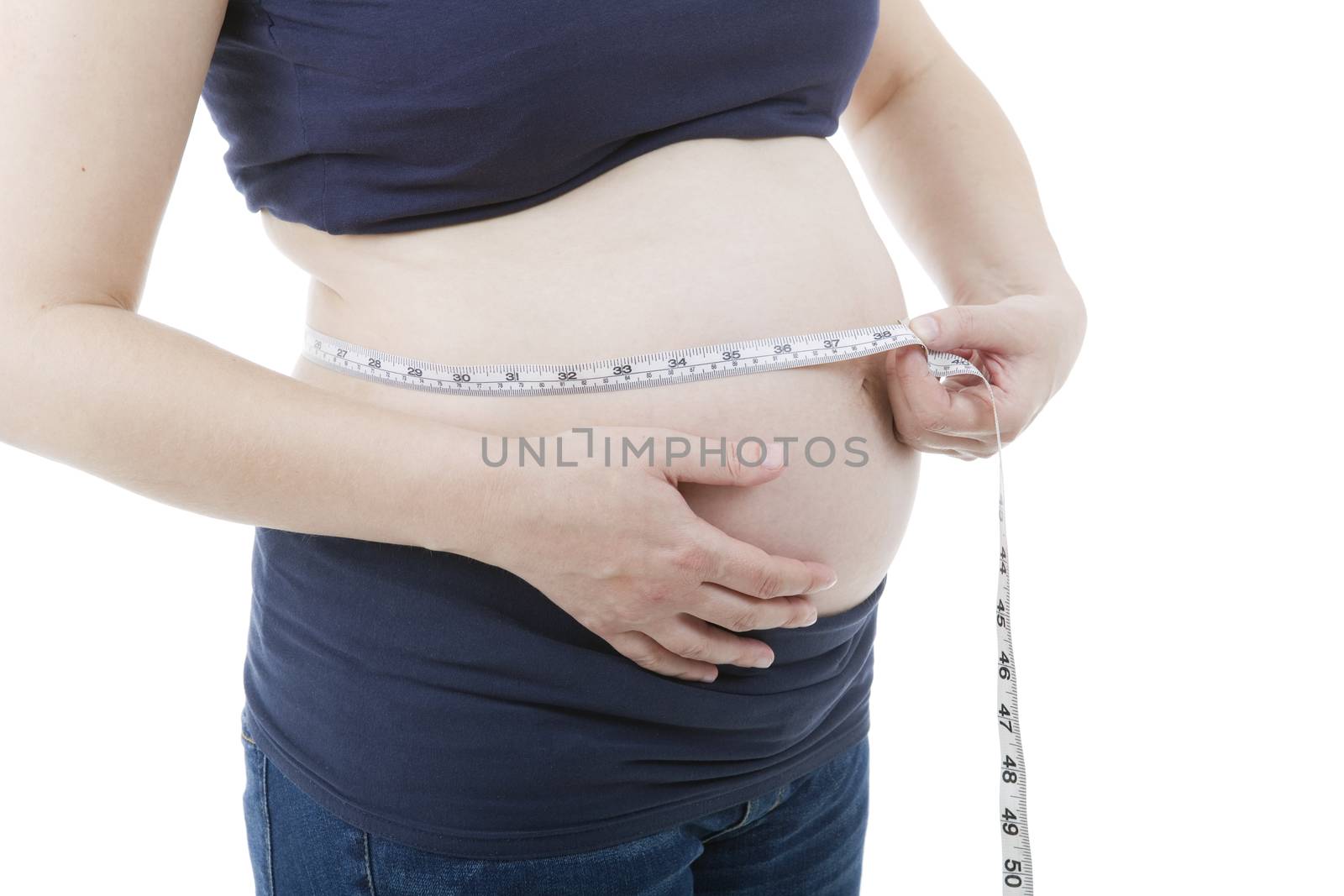 Closeup of pregnant woman at white background