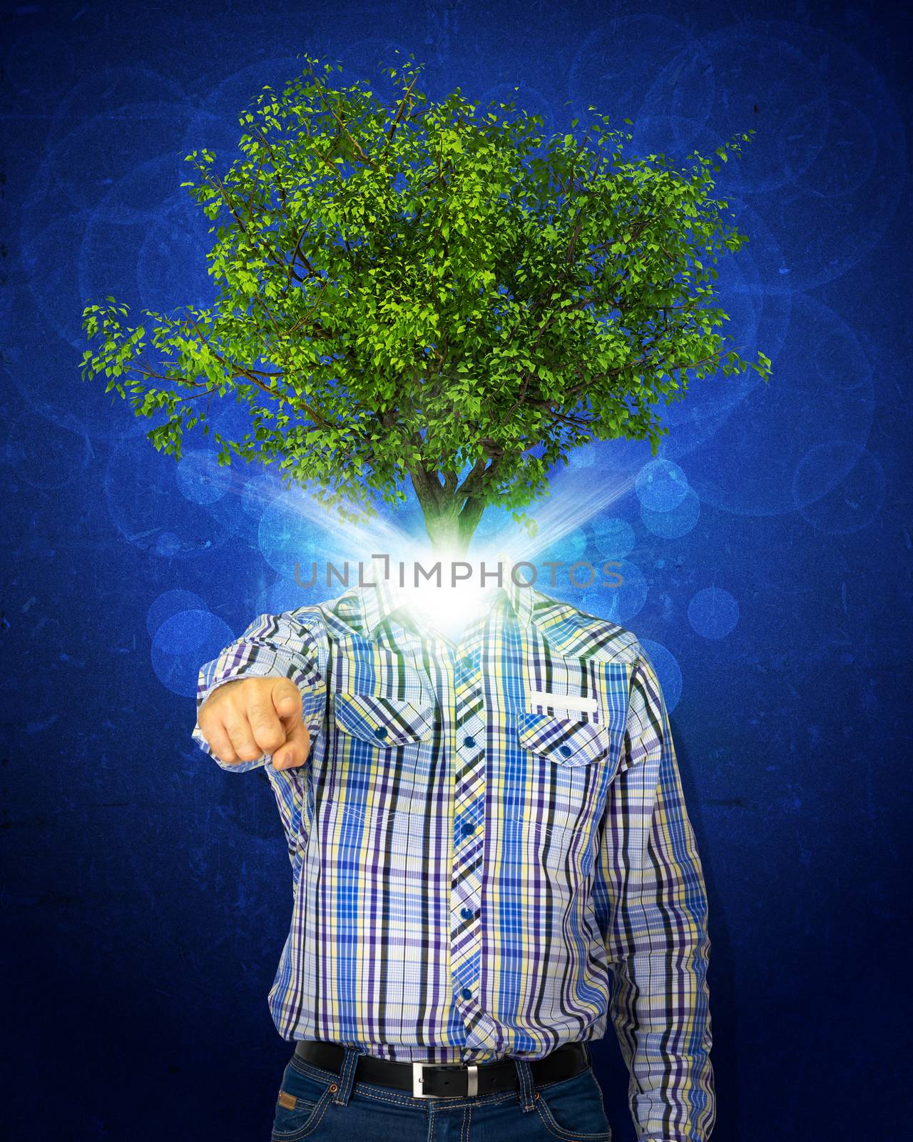 Man stand with green tree and bright light instead his head. Eco concept