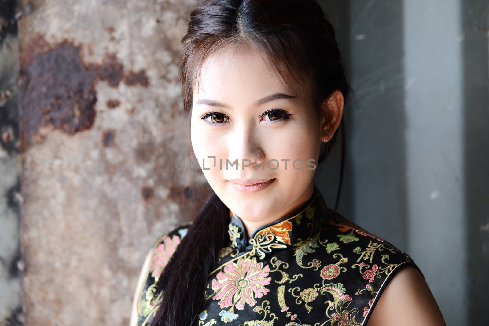 Chinese girl in traditional Chinese cheongsam blessing