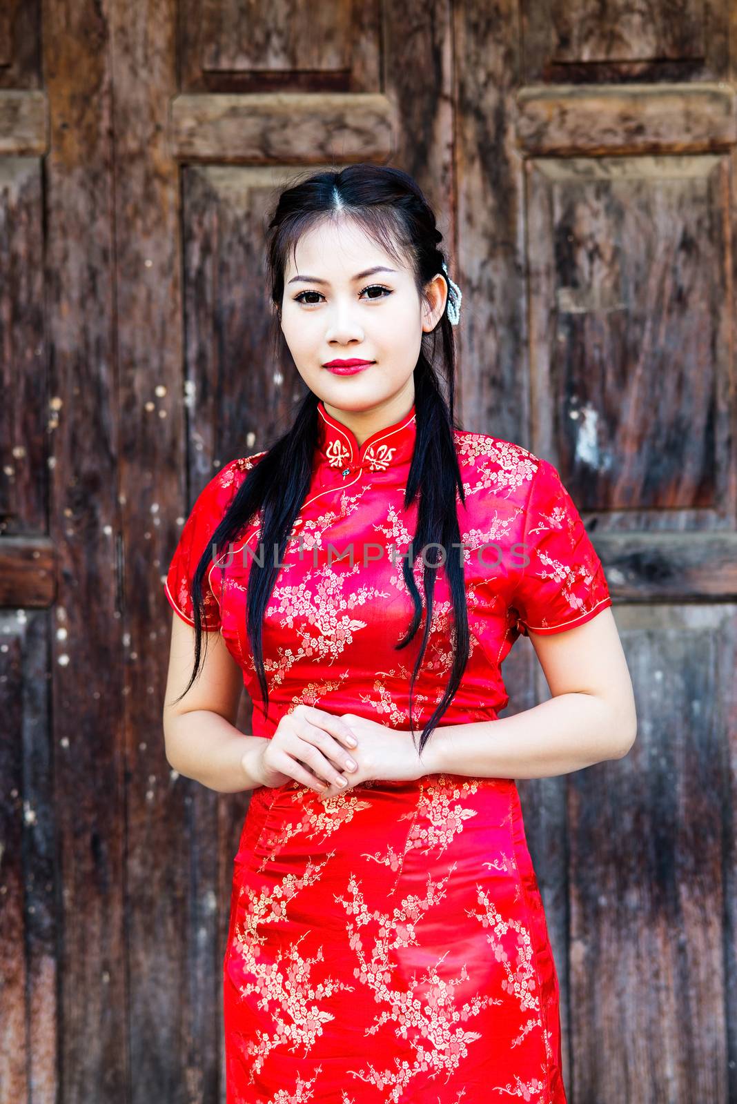 Chinese girl in traditional Chinese cheongsam blessing by Yuri2012