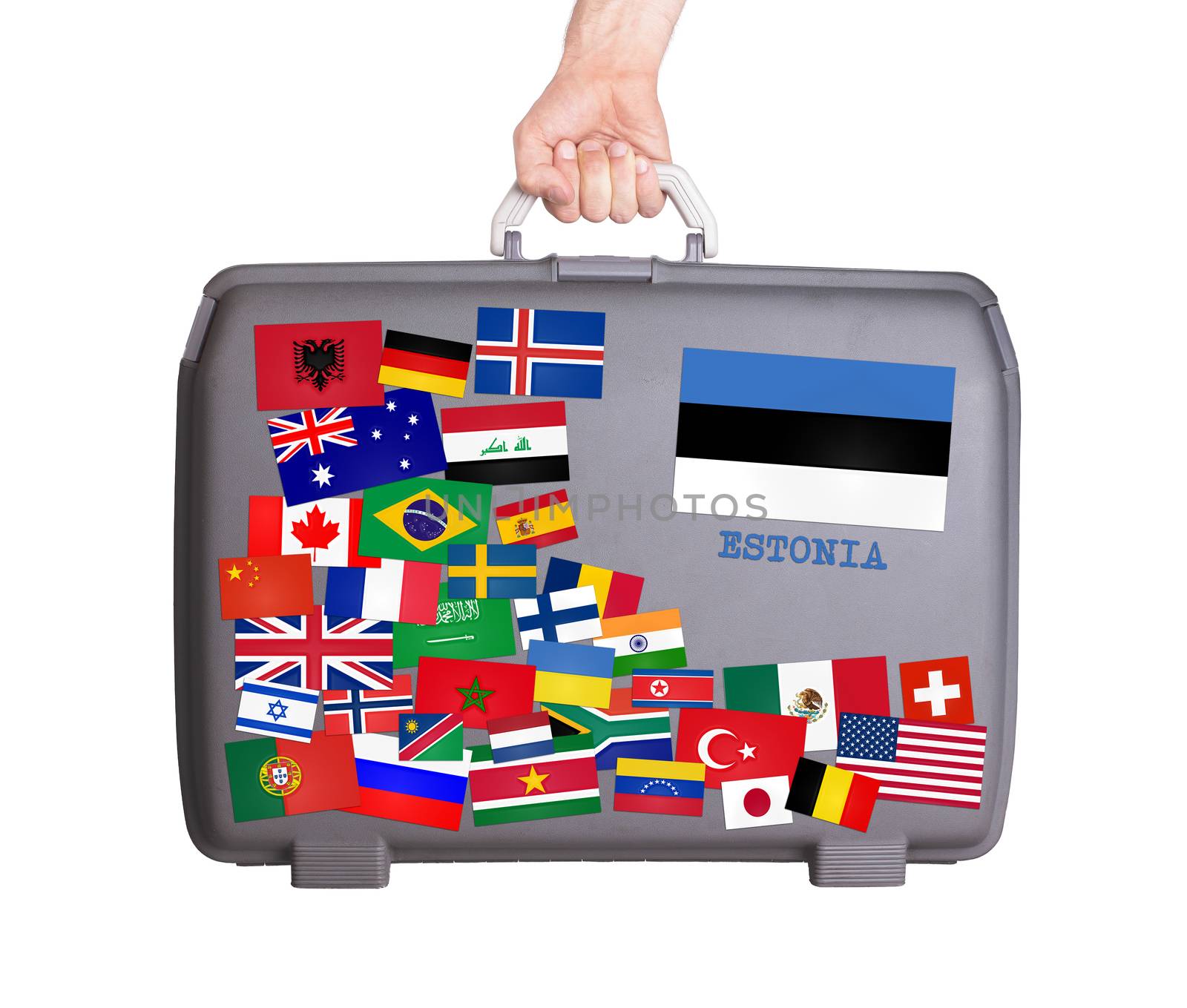 Used plastic suitcase with lots of small stickers, large sticker of Estonia