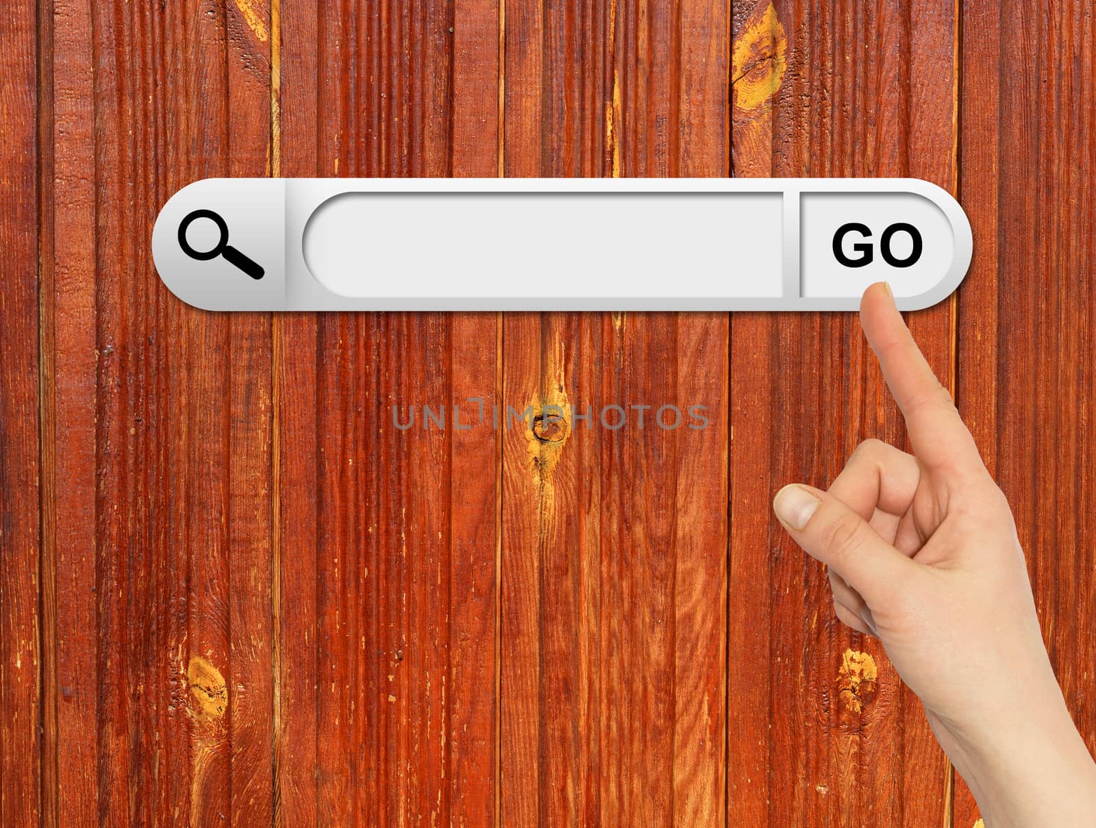 Human hand indicates the search bar in browser. Aged wooden painted surface on background