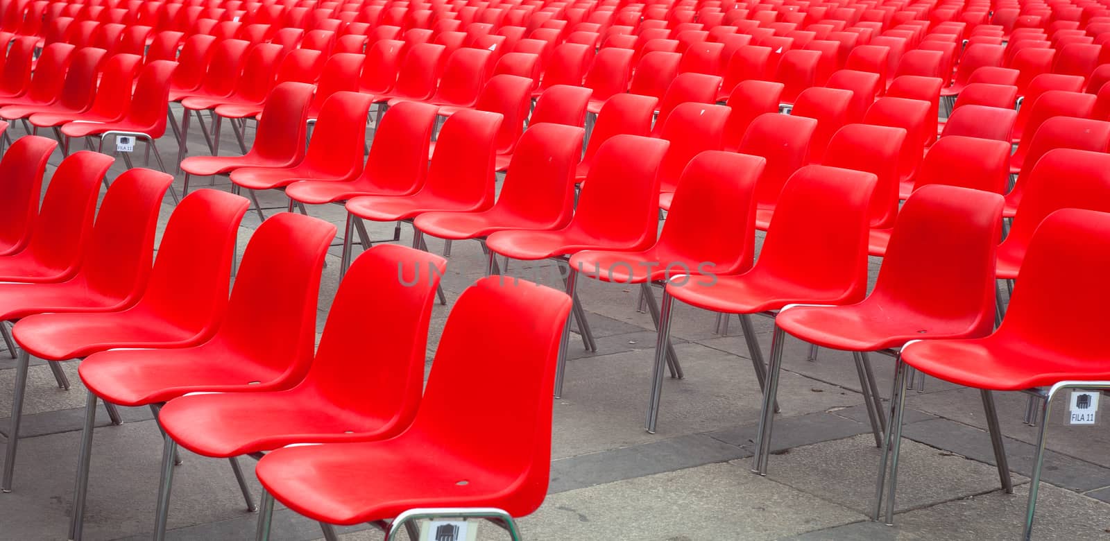 View of many red chairs ready for conference