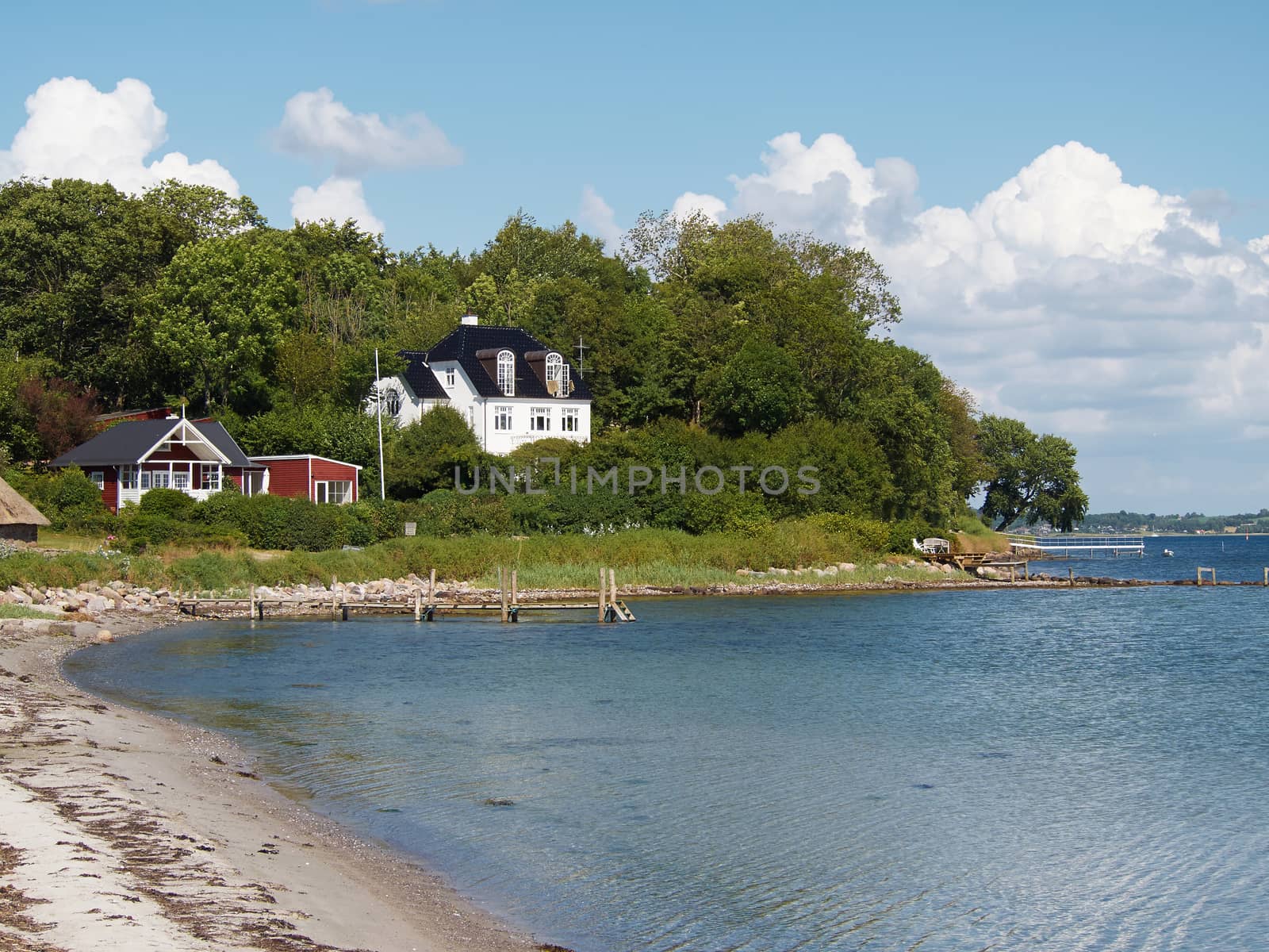 Beautiful houses by the beach coast Funen Faaborg Denmark 