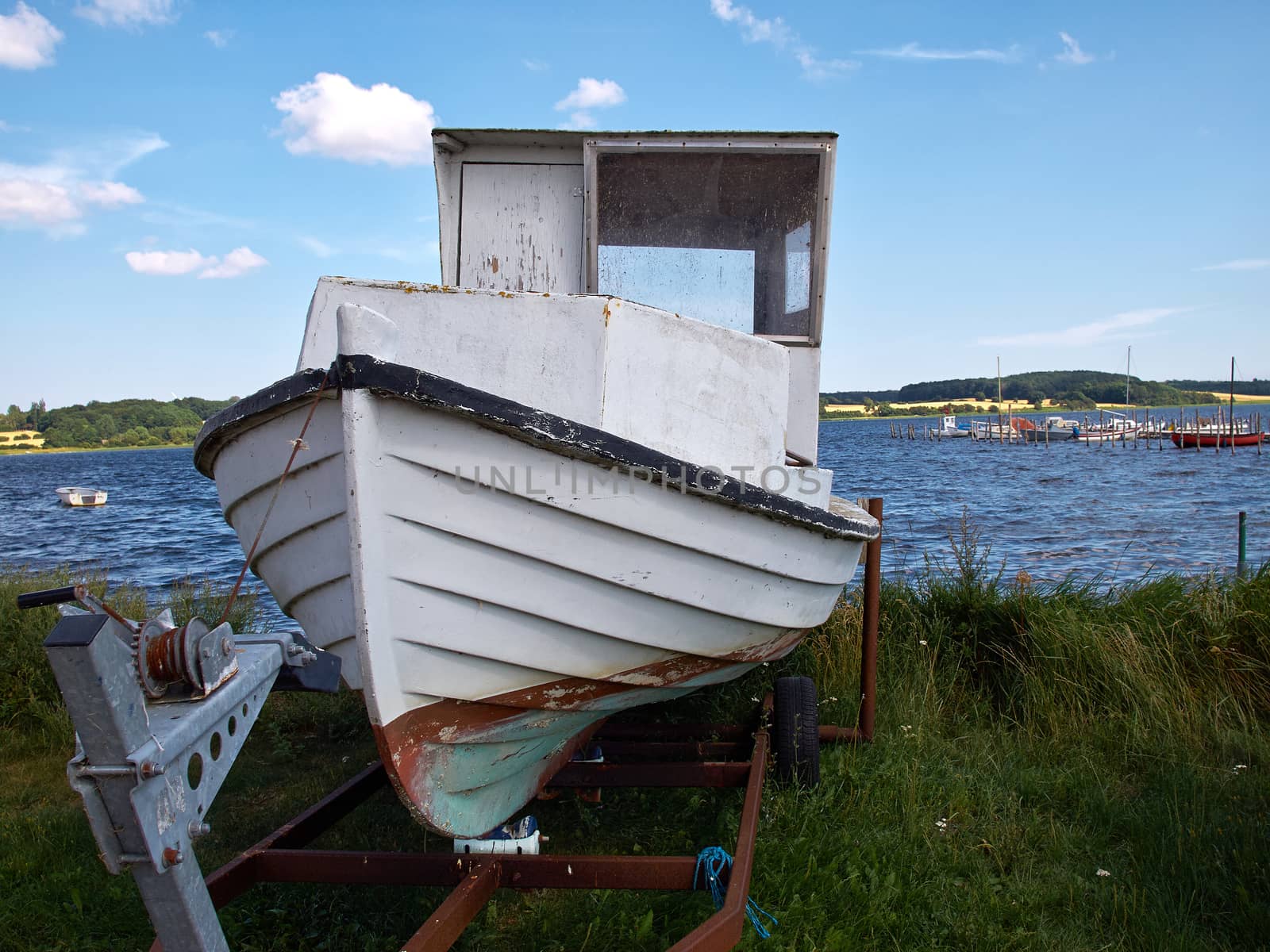 Small wooden old fishing boat on the beach Funen Denmark   