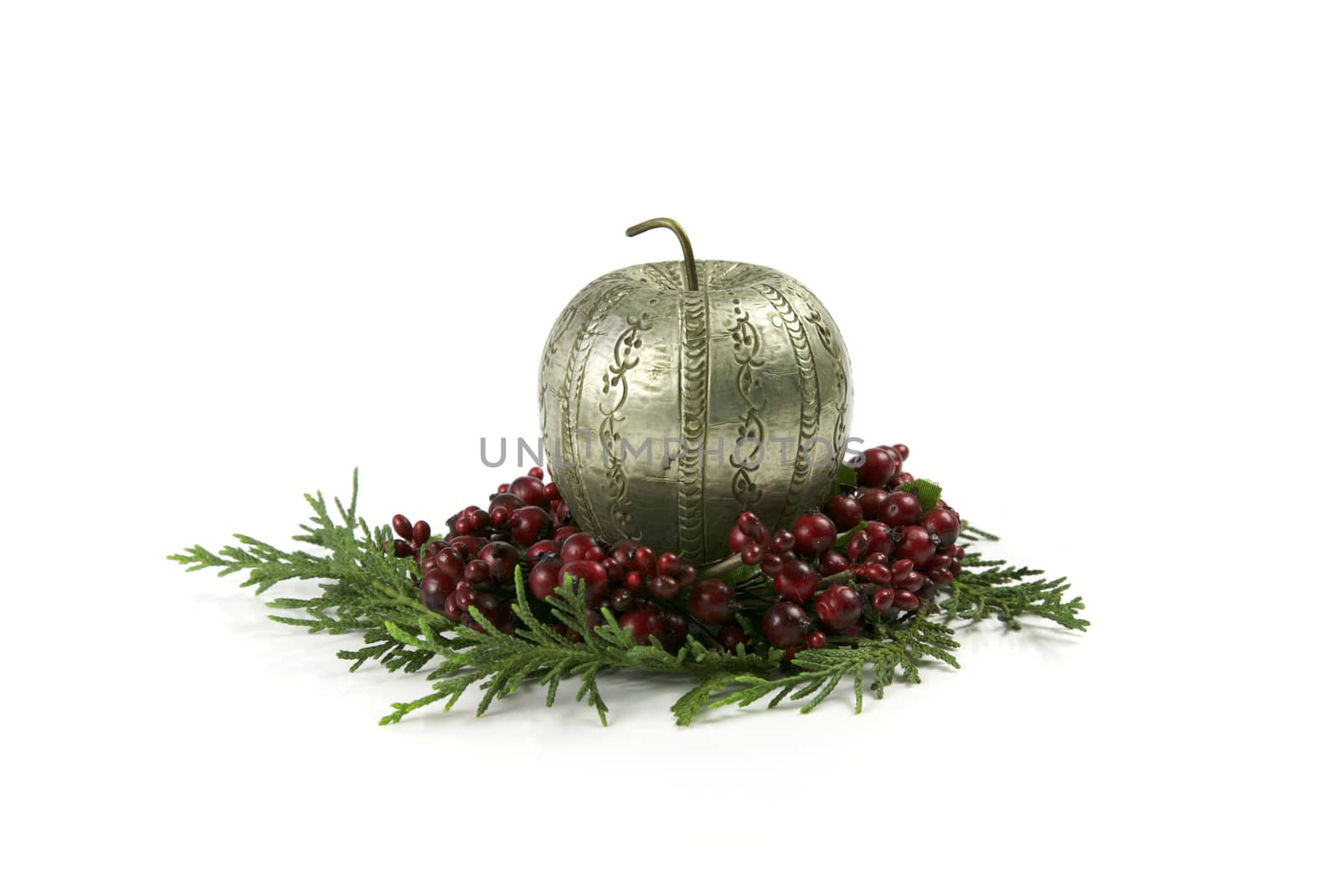 Christmas Apple Made of Silver on top of red Berries and the Christmas Tree, Seasonal Holidays