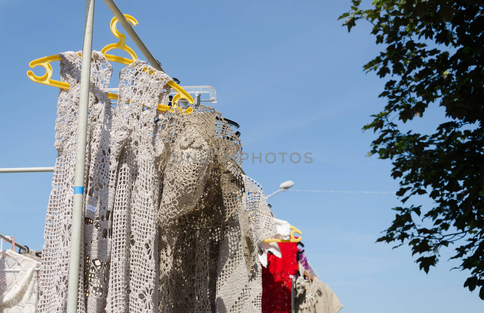 crocheted linen ladies blouses hang in fair by sauletas