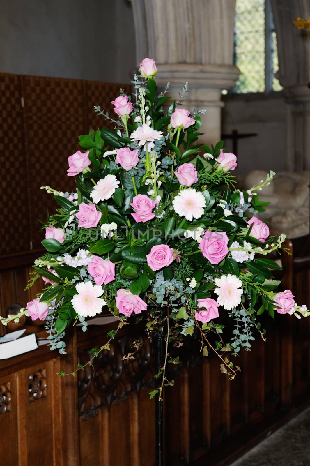 Wedding day flowers in church by kmwphotography