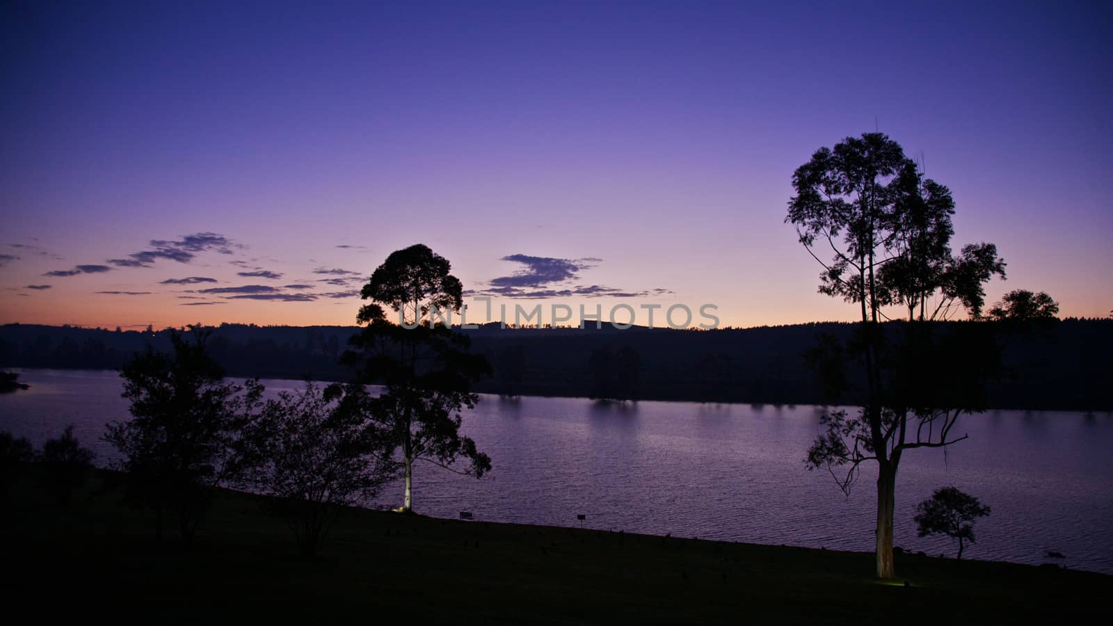 Sun Setting Over a Lake Early in the Morning and a Great Background