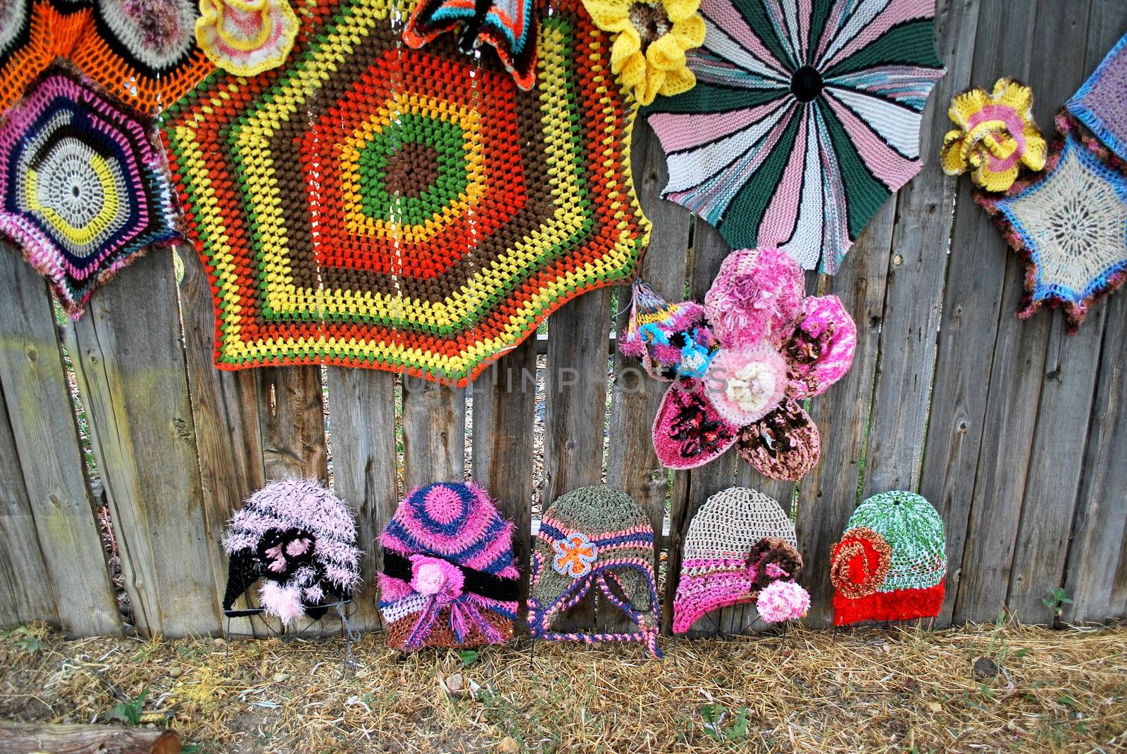 Crochet designs displayed outdoors.