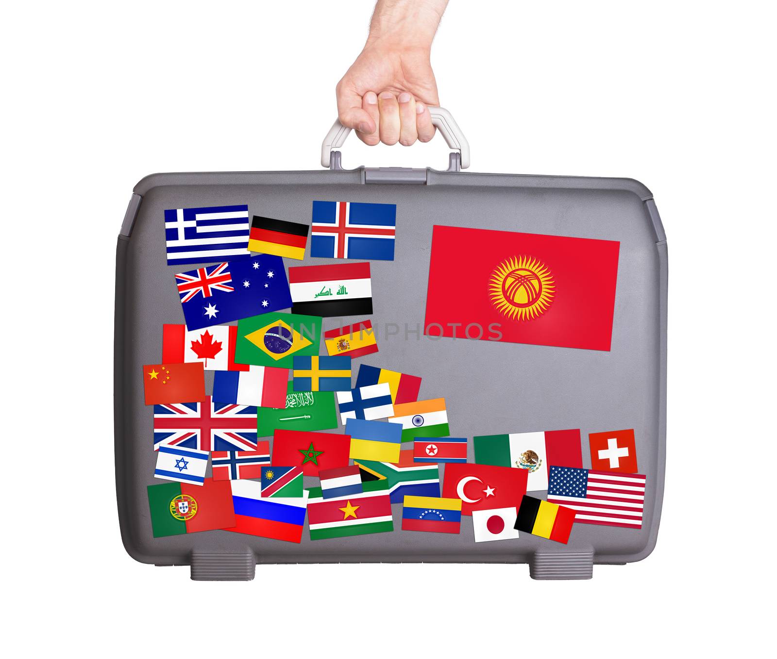 Used plastic suitcase with lots of small stickers, large sticker of Kyrgyzstan