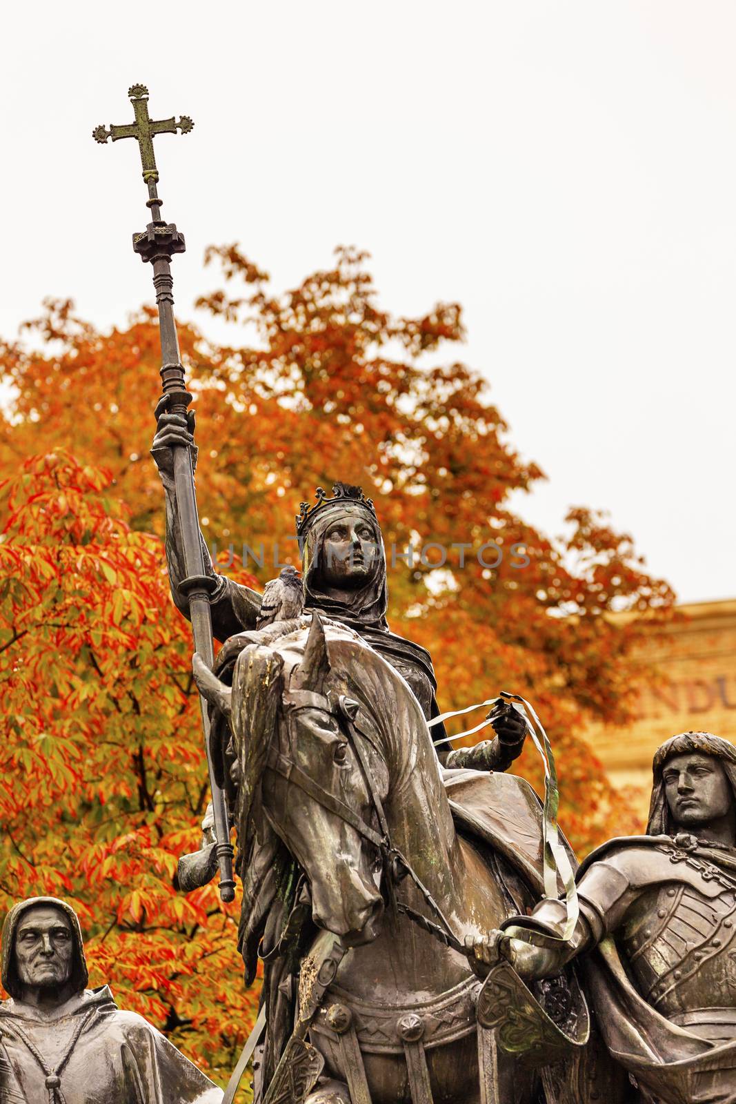 Queen Isabella of Castile Statue Riding a Horse  Marching into Granada 1492 with Cardinal Mendoza and Gonzalo de Cordoba Paseo de la Castellena Madrid Spain.  Statue made of Bronze and Stone by Manuel Oms y Canet in 1883.