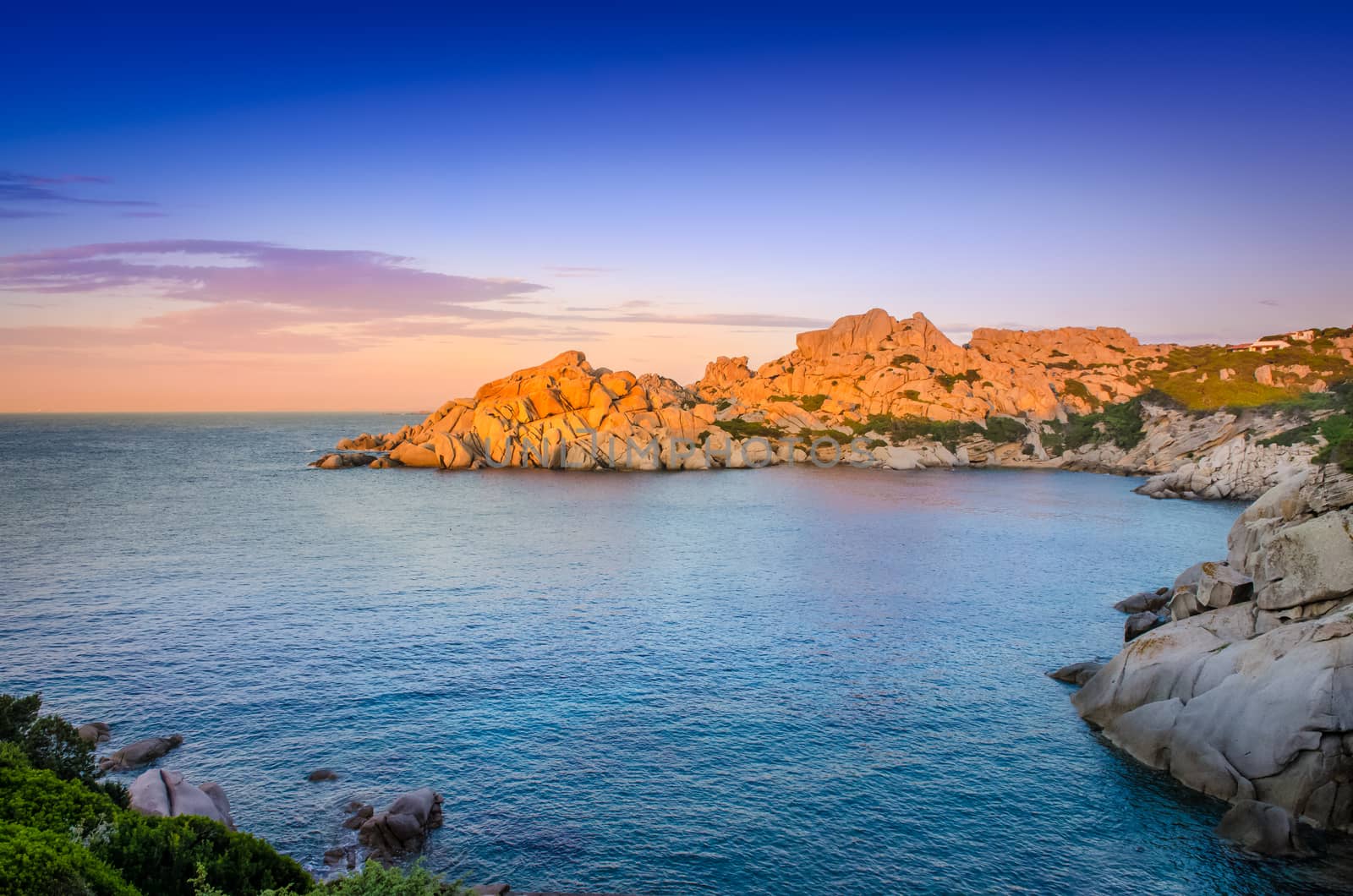 Ocean rocky coastline colorful sunset view, Sardinia by martinm303