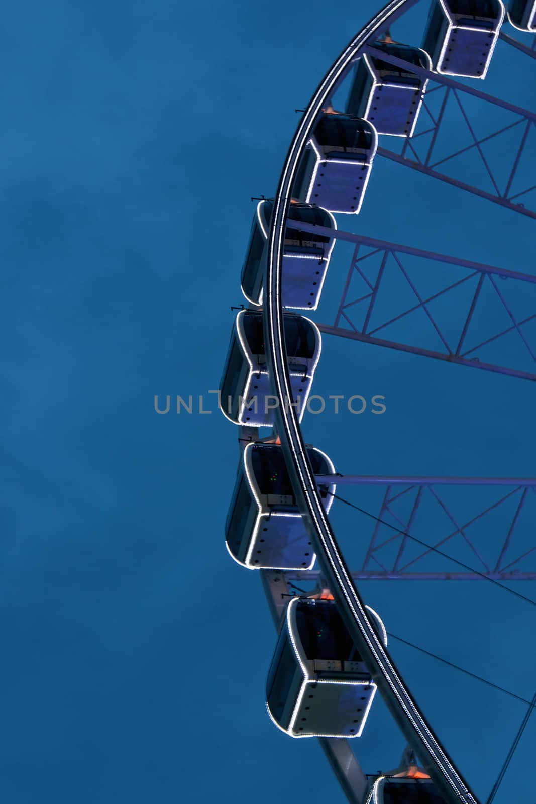 Giant swing is big wheel retro on blue sky background.