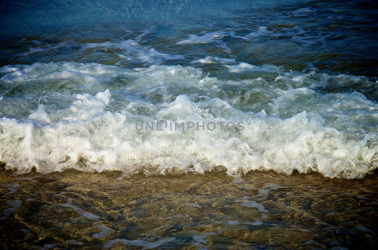 Splashing Waves in Transparent Sea Water on Coast Line Outdoors 