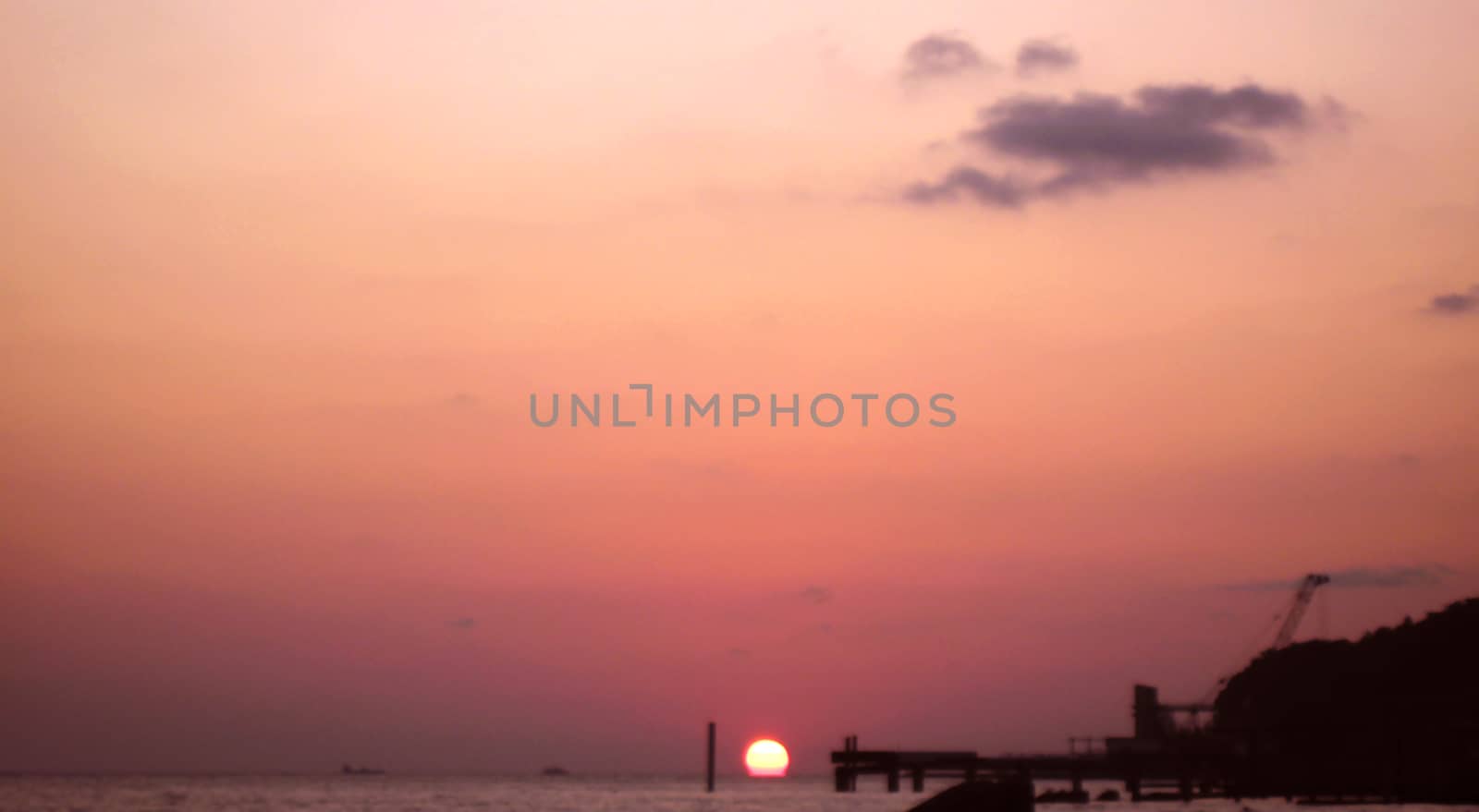 Sunset over summer sea with a small waves
