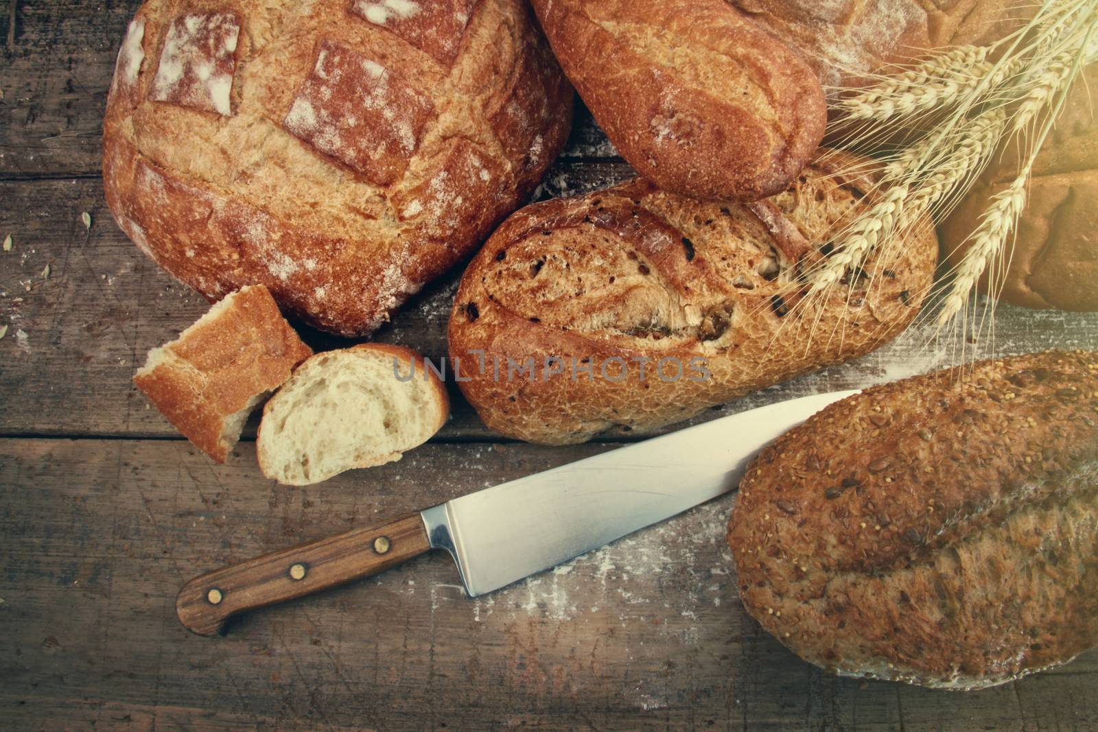 Assortment of homemade breads on wood