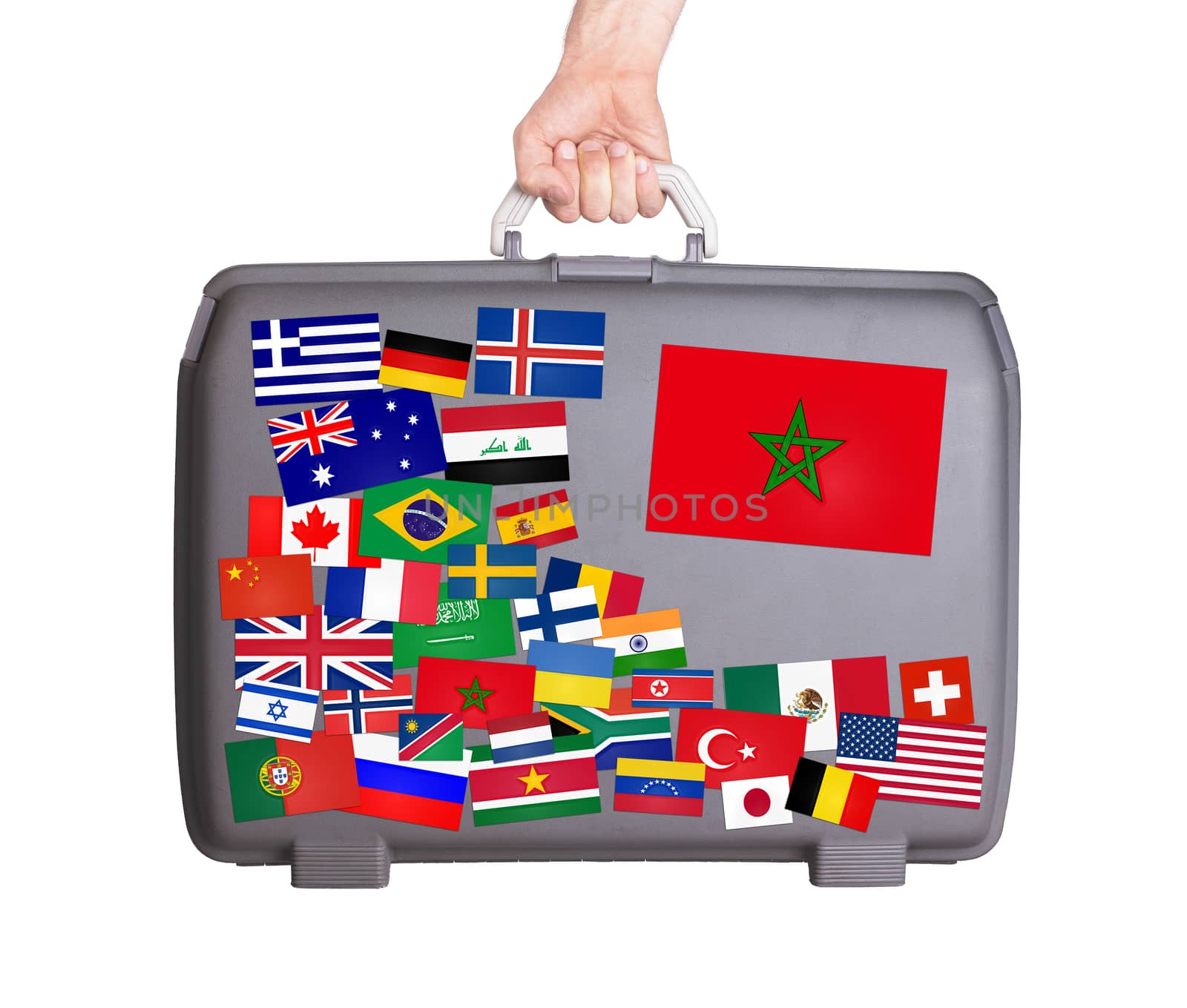 Used plastic suitcase with lots of small stickers, large sticker of Morocco