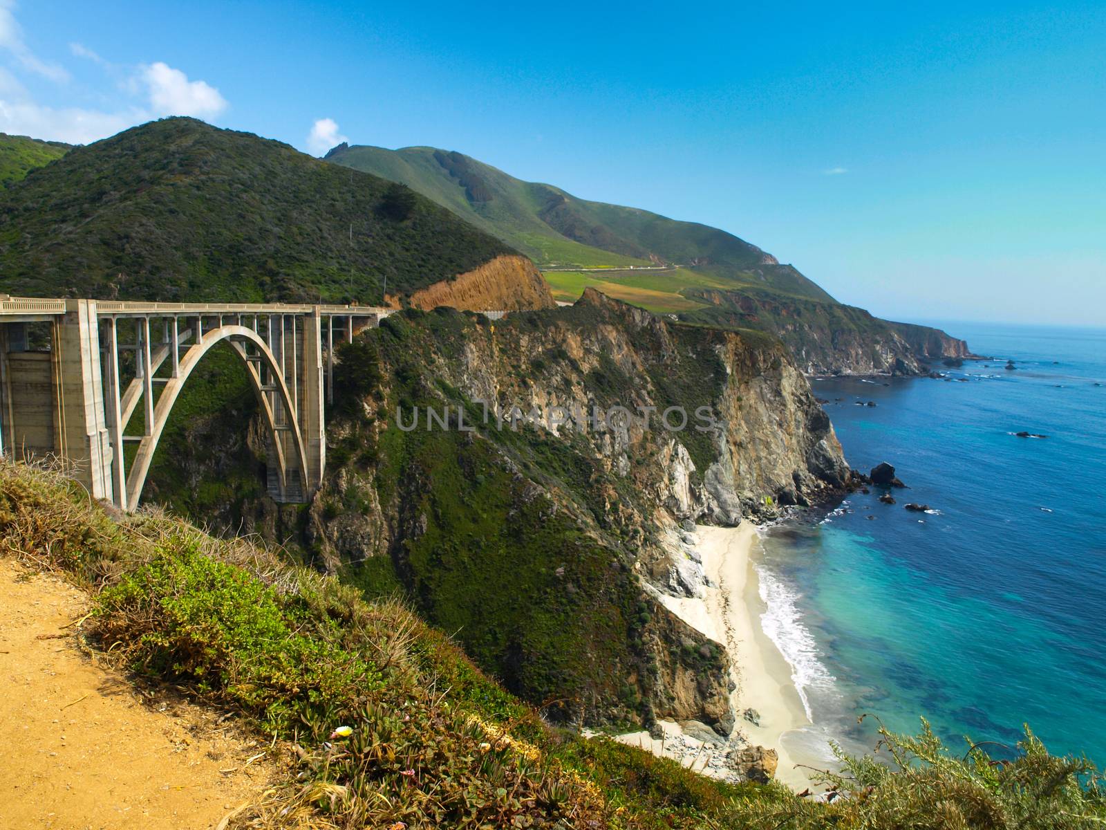 Bridge on Pacific rocky coast of California by pyty