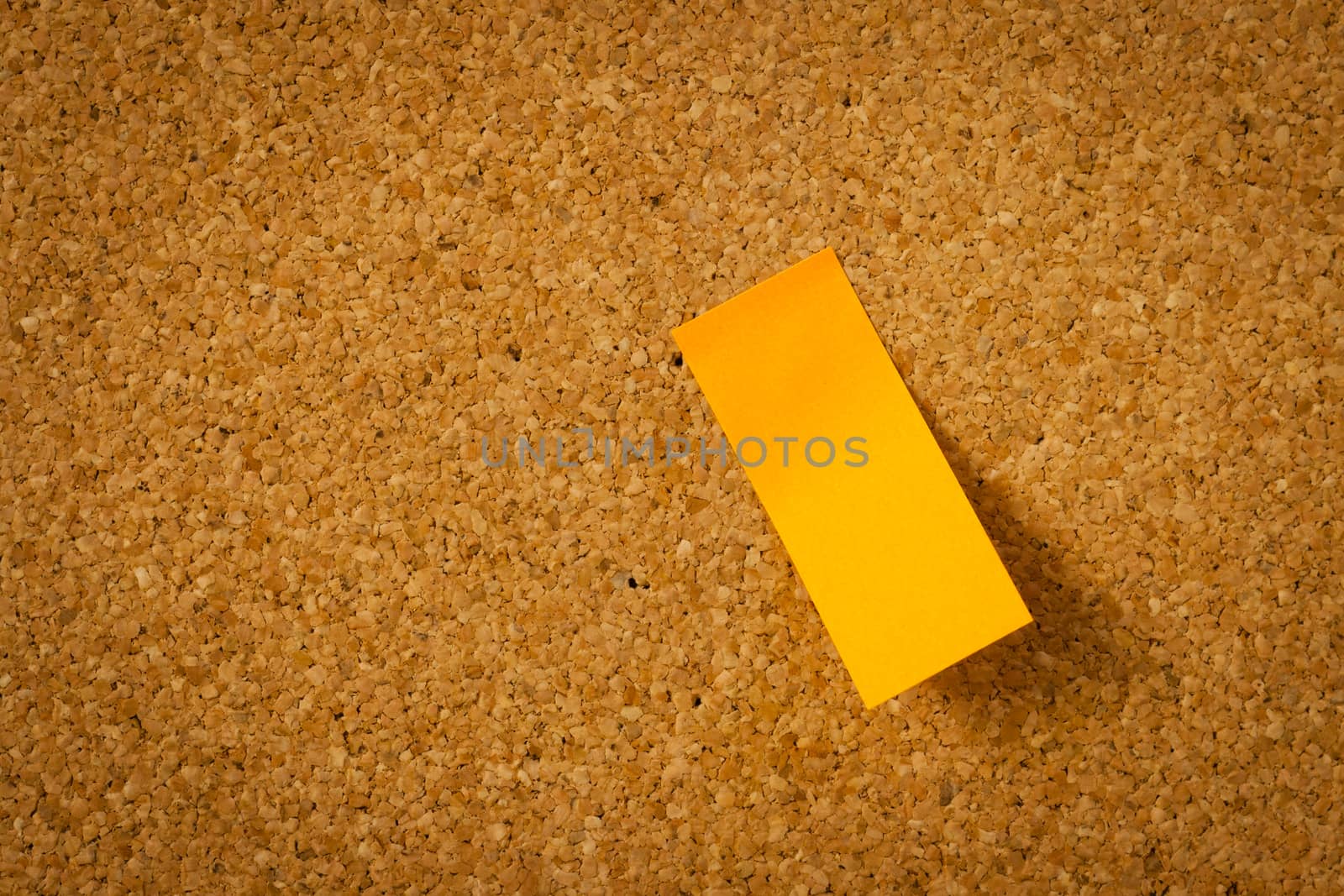 image of color blank post-it reminder on corkboard